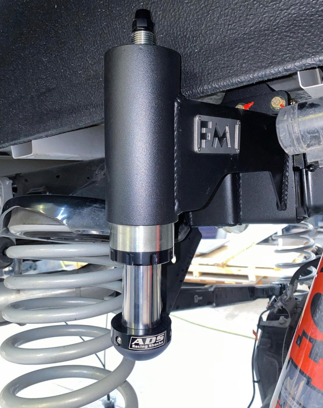 2021-2024 Ford Raptor rear bump stop kit installed, showcasing high-performance components and suspension system.