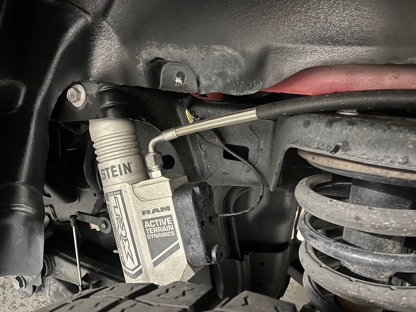 2025+ Dodge RAM RHO Strut Protection Panel showcasing suspension components and strut assembly for enhanced durability.