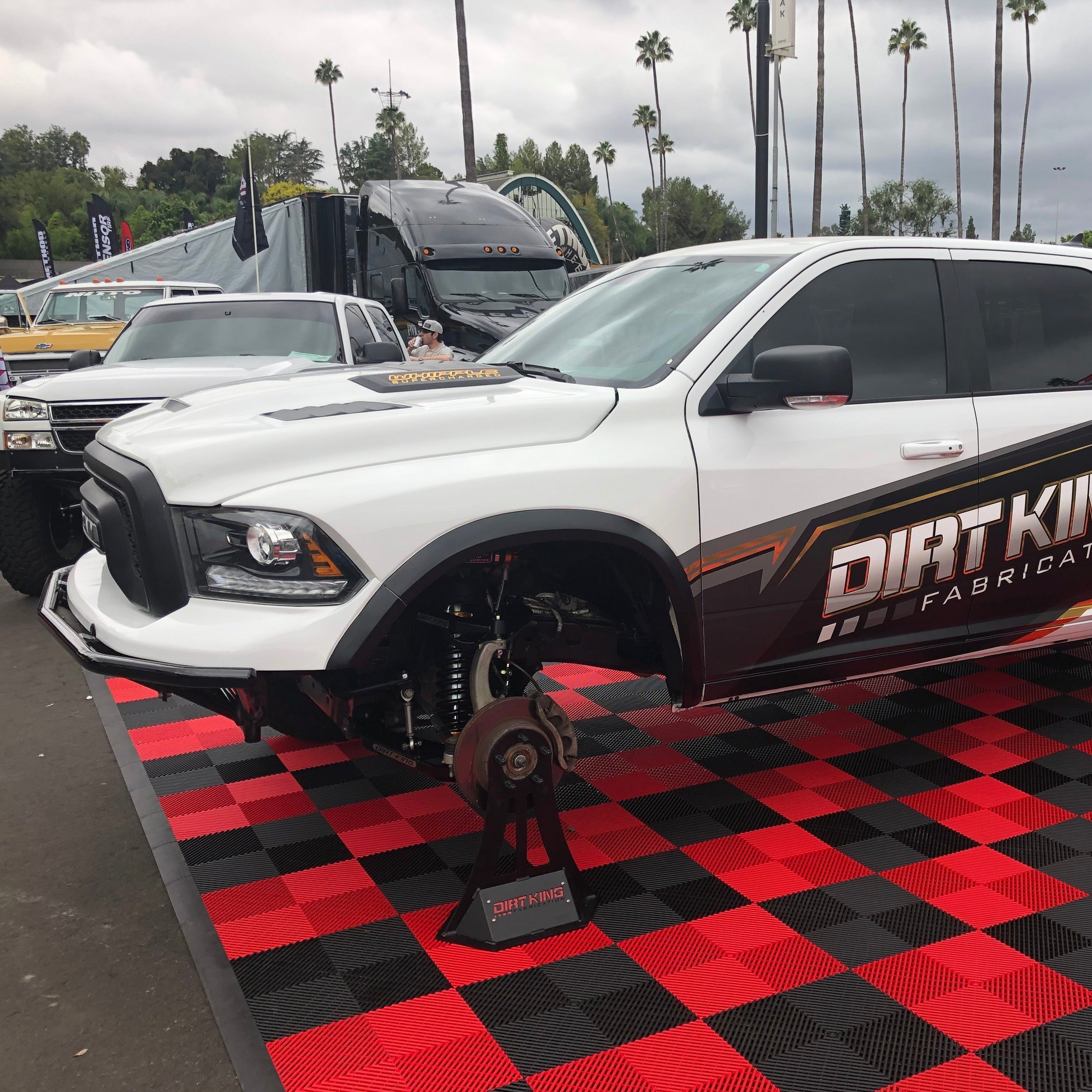 2009-2018 Dodge Ram TRX Kit displayed on a truck with a custom lift and offroad features at an outdoor event.