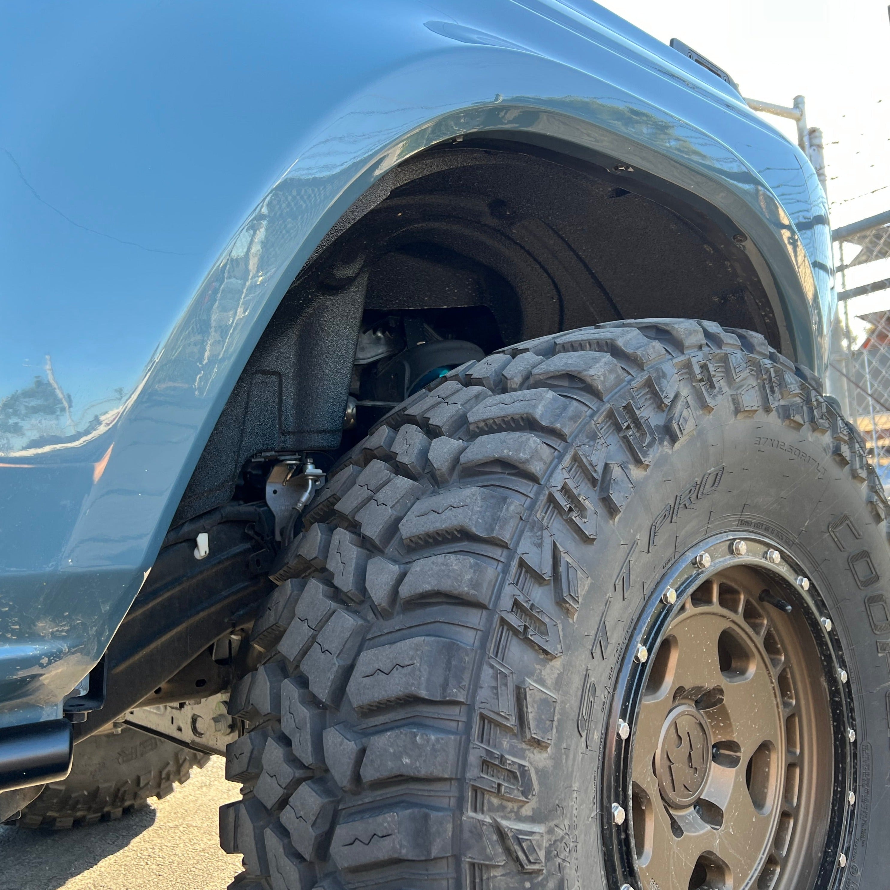 2021-2025 Ford Bronco fenders showcasing rugged design and large off-road tires for enhanced performance and style.