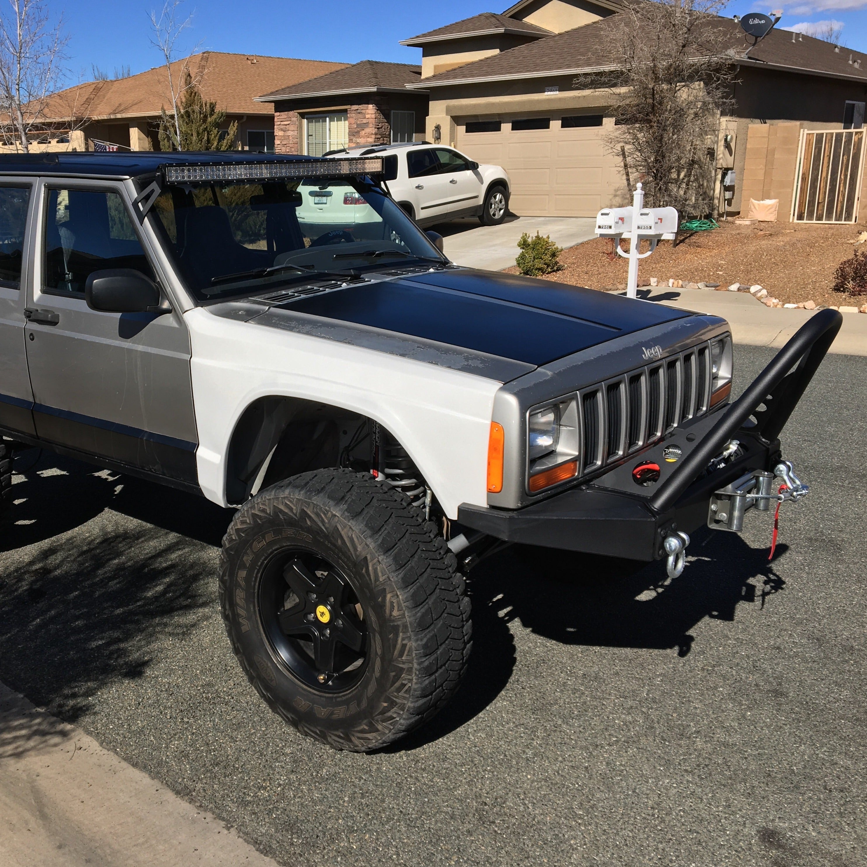 1986-1992 Jeep Comanche fenders installed on a modified Jeep with offroad tires and a winch, showcasing rugged design.