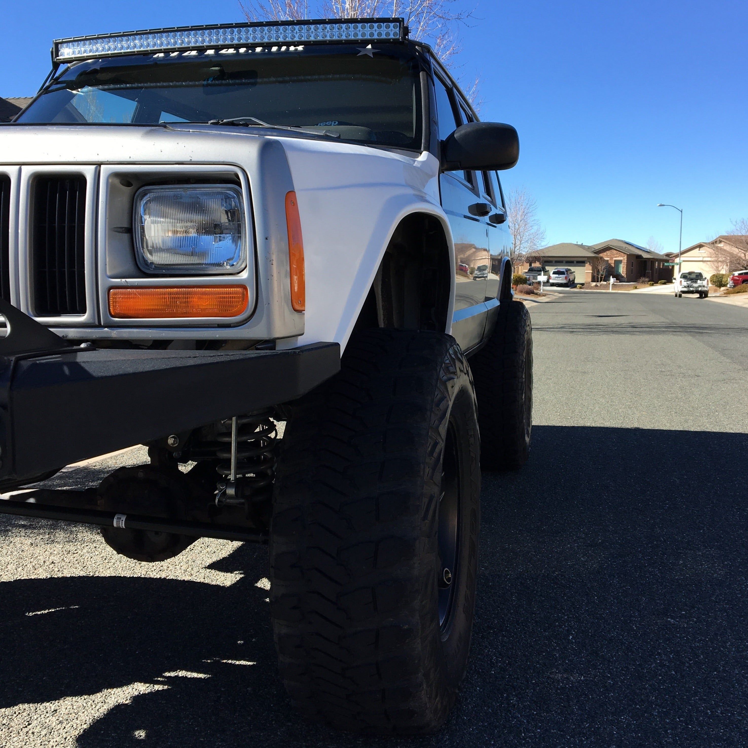 1986-1992 Jeep Comanche fenders installed on a lifted Jeep, showcasing rugged design and off-road capability.