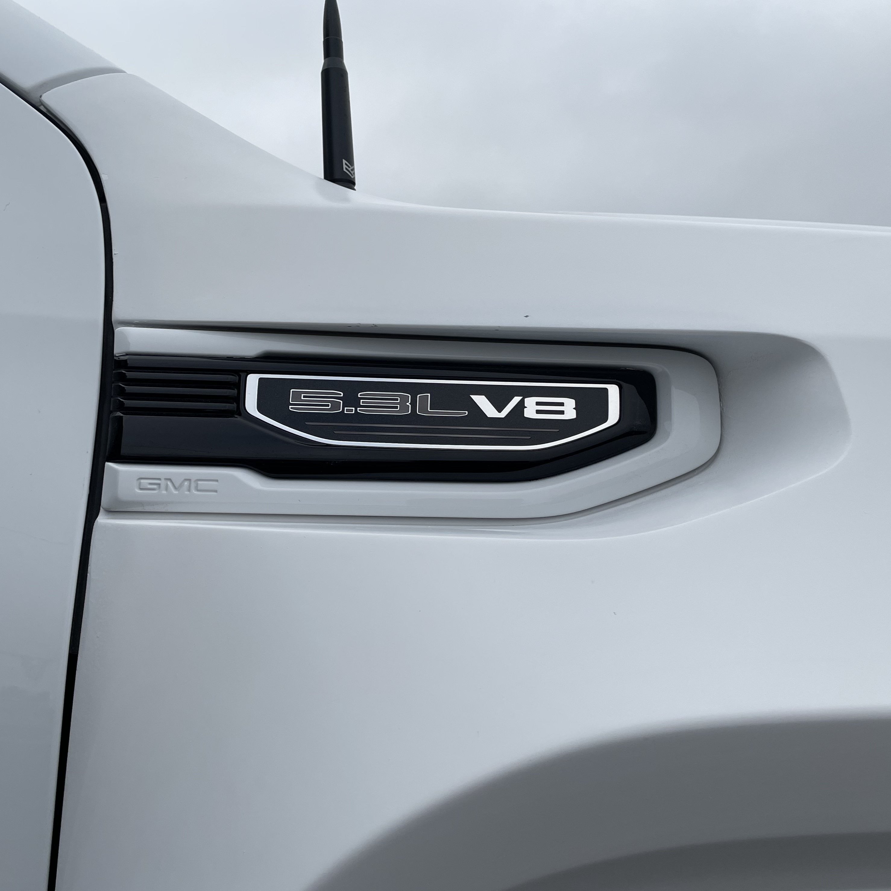 2019-2025 GMC Sierra fenders showcasing a sleek design and V8 engine badge for enhanced truck performance.