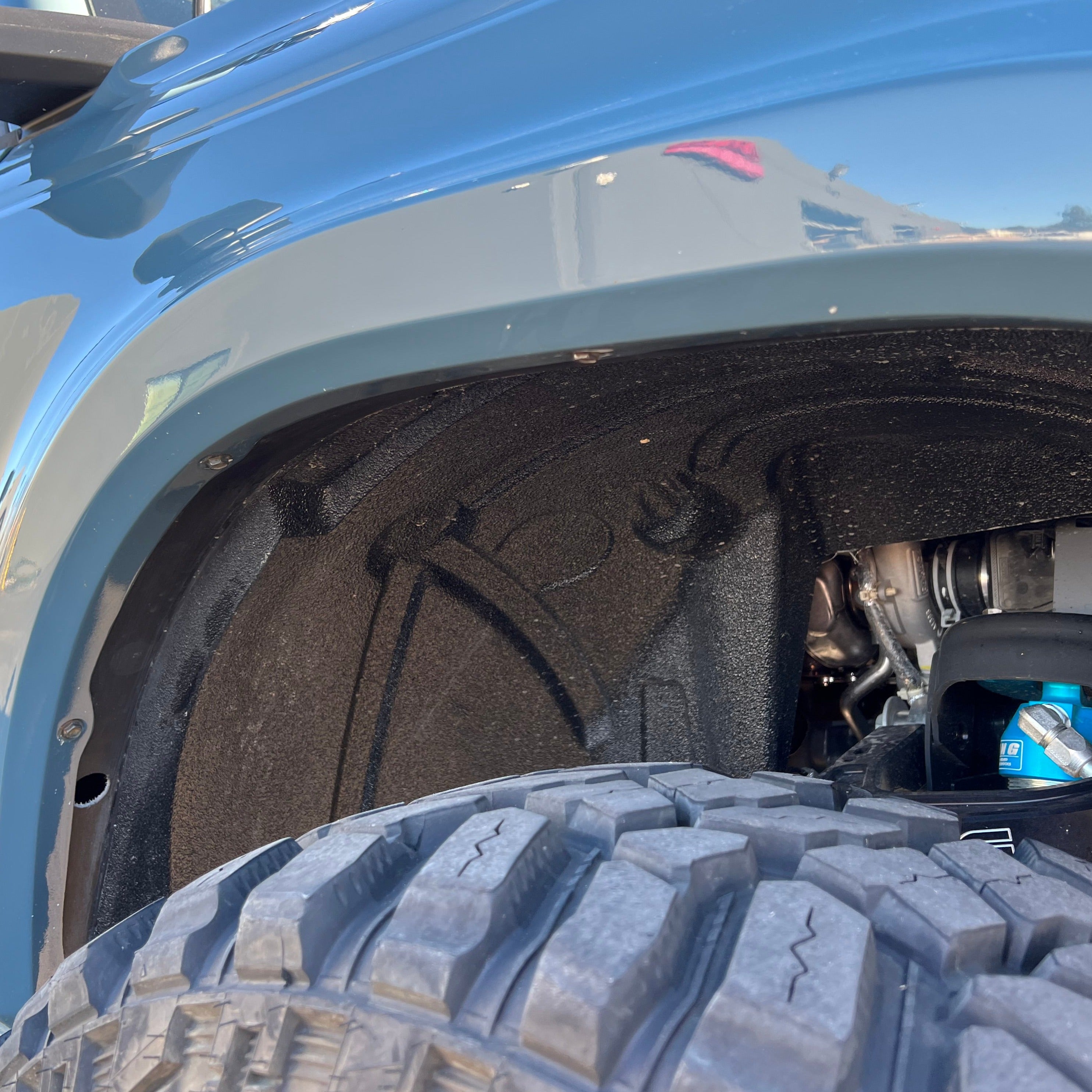 2021-2025 Ford Bronco fender showcasing interior design and tire clearance for enhanced offroad performance.