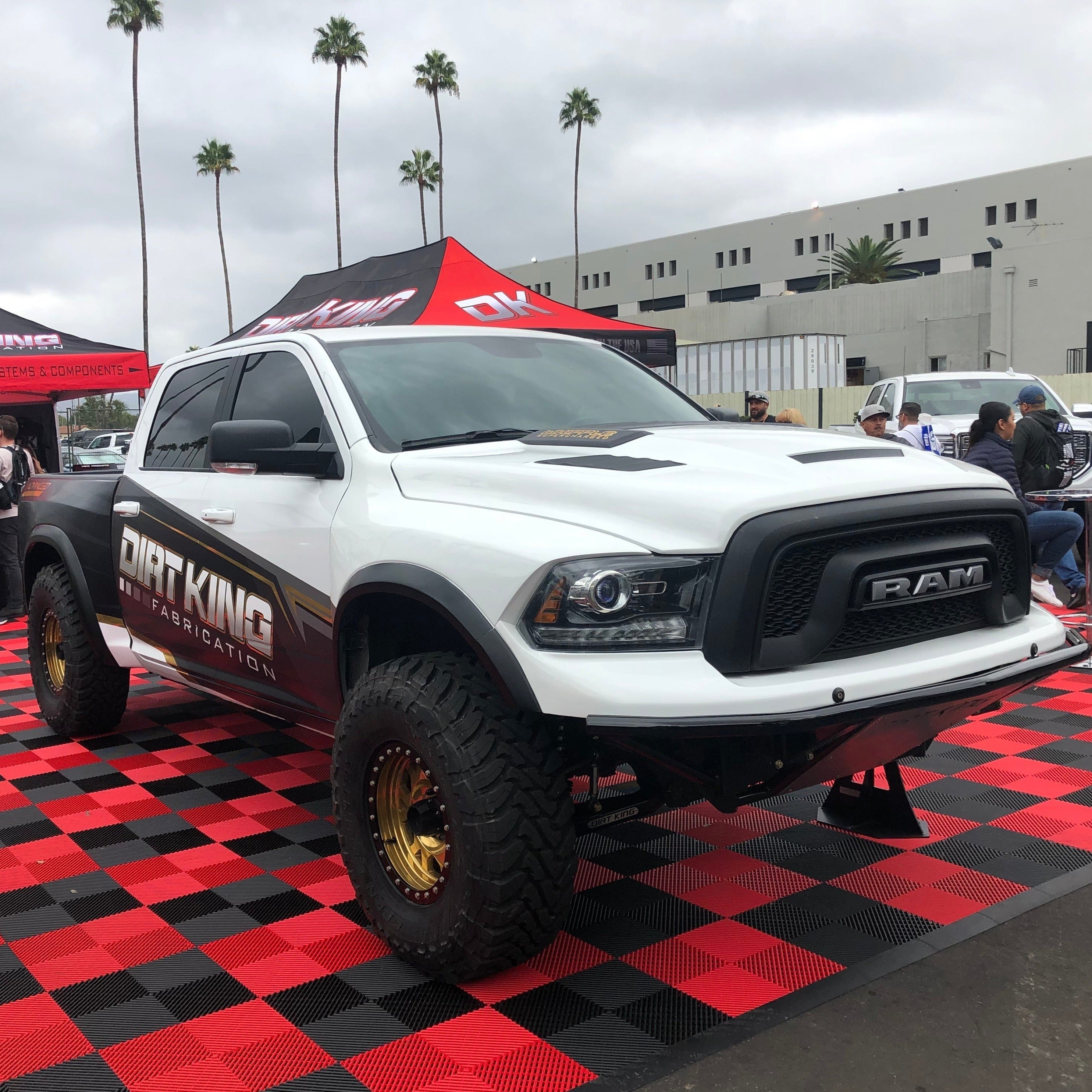 2009-2018 Dodge Ram with TRX Kit showcasing offroad capabilities and custom modifications at an outdoor event.