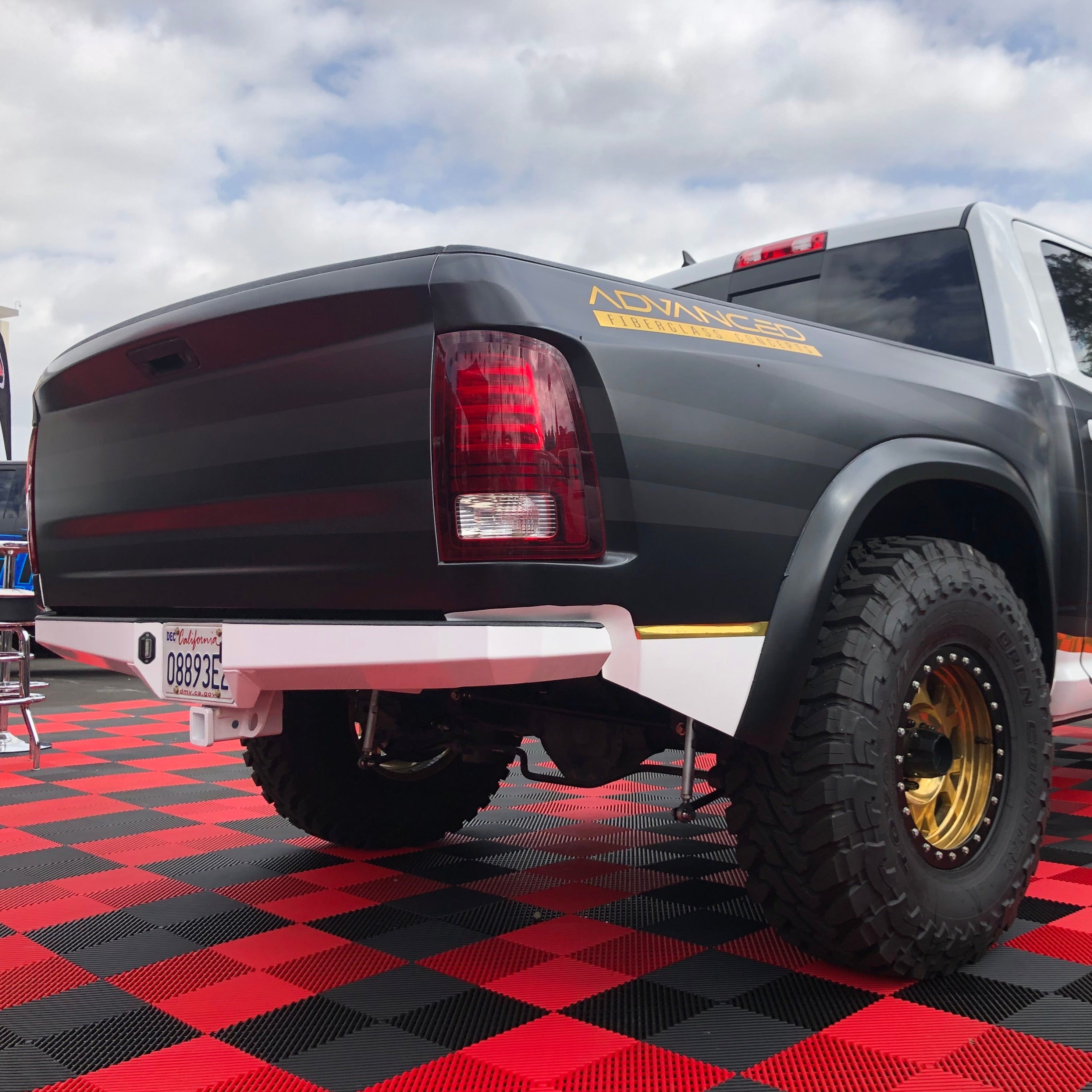 2009-2018 Dodge Ram TRX Kit showcasing a modified truck with rugged tires and a custom rear design.
