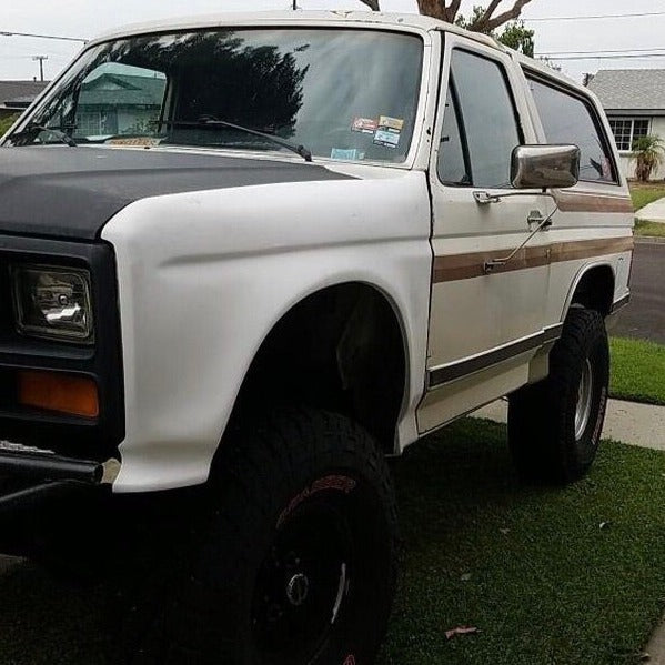 1980-1986 Ford Bronco fenders showcasing a classic off-road vehicle with a lifted stance and rugged tires.