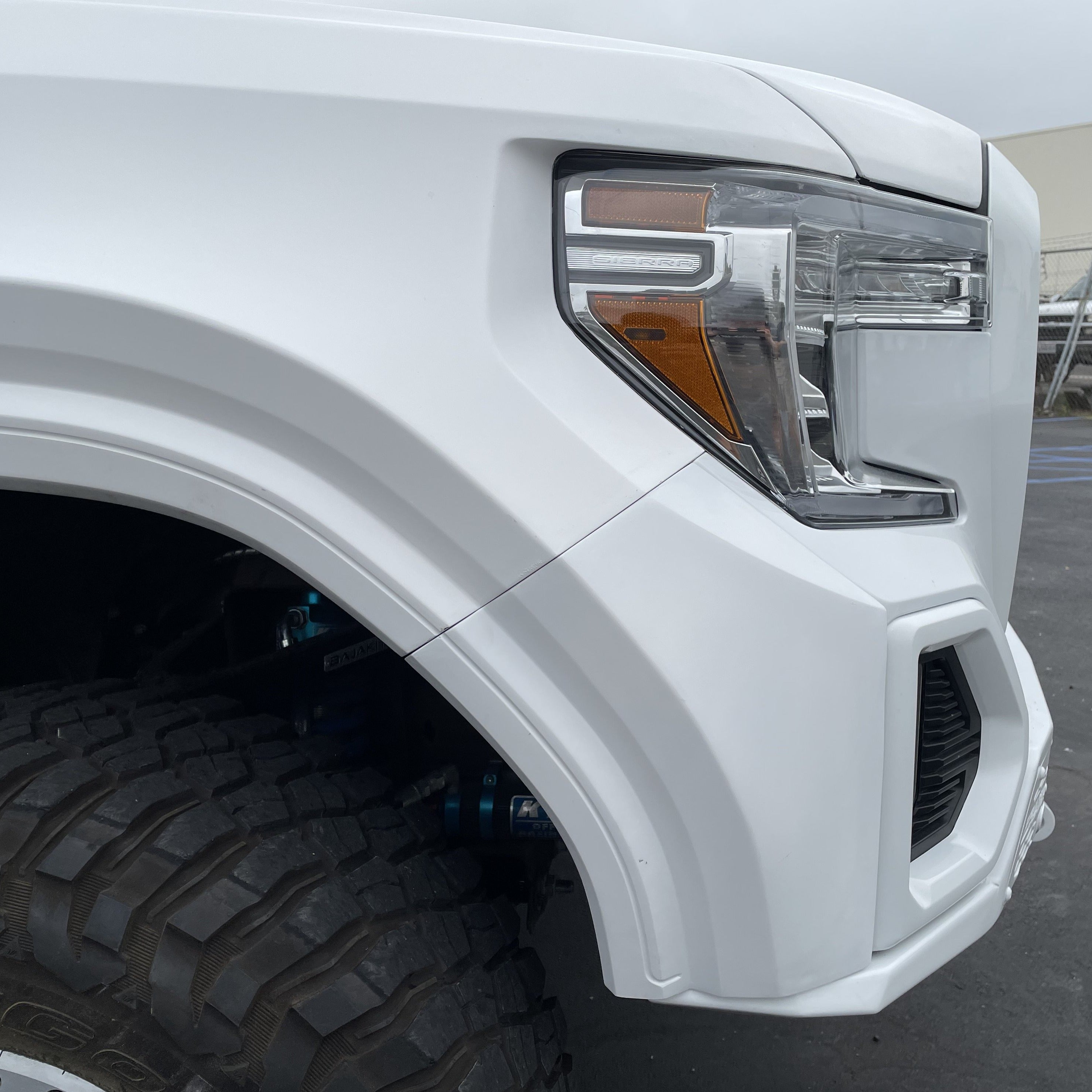 2019-2025 GMC Sierra fender showcasing a sleek design and rugged construction for enhanced off-road performance.