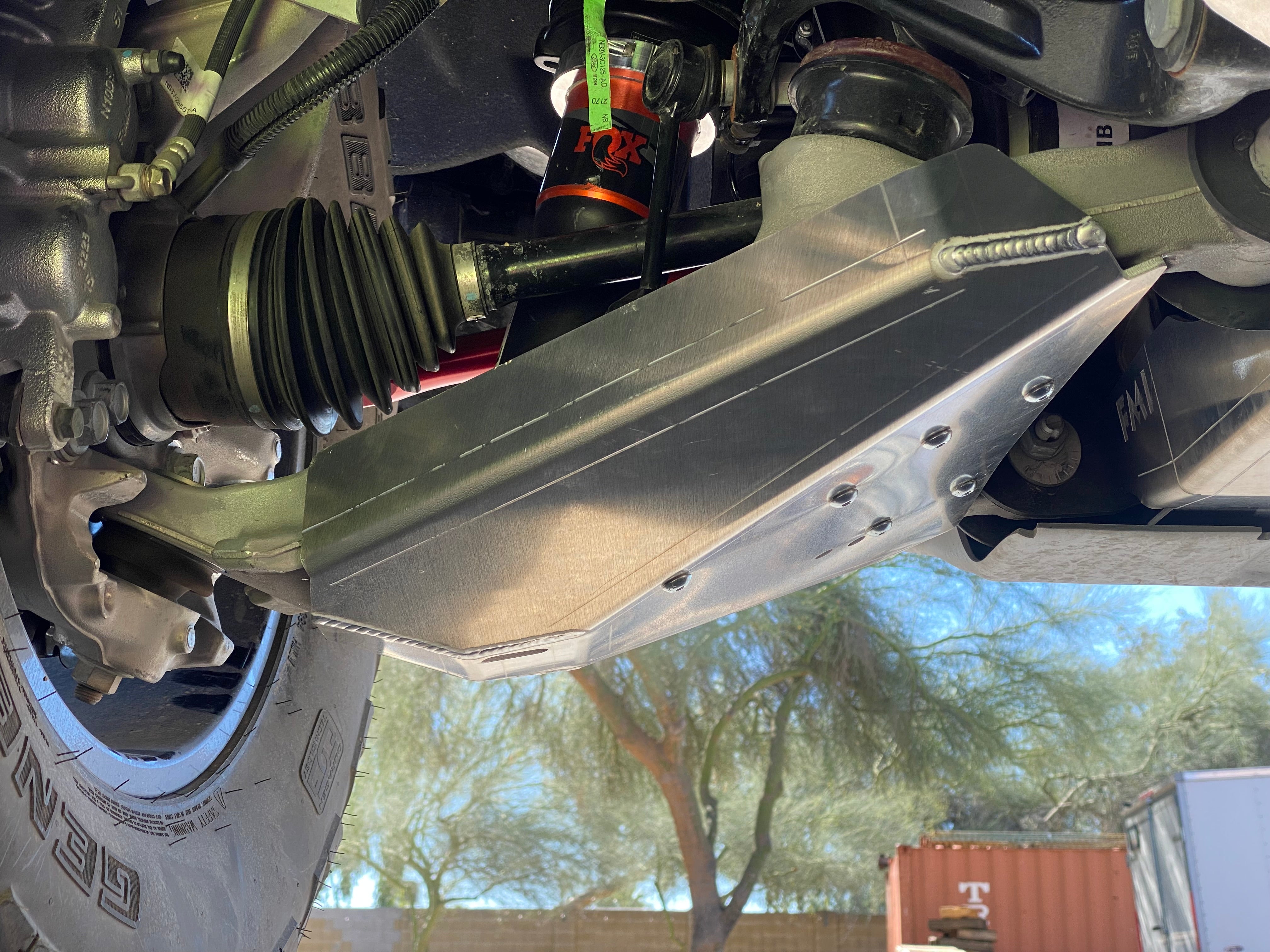 Bronco Raptor 2022 lower control arm skid plate kit installed, showcasing durable protection for offroad performance.