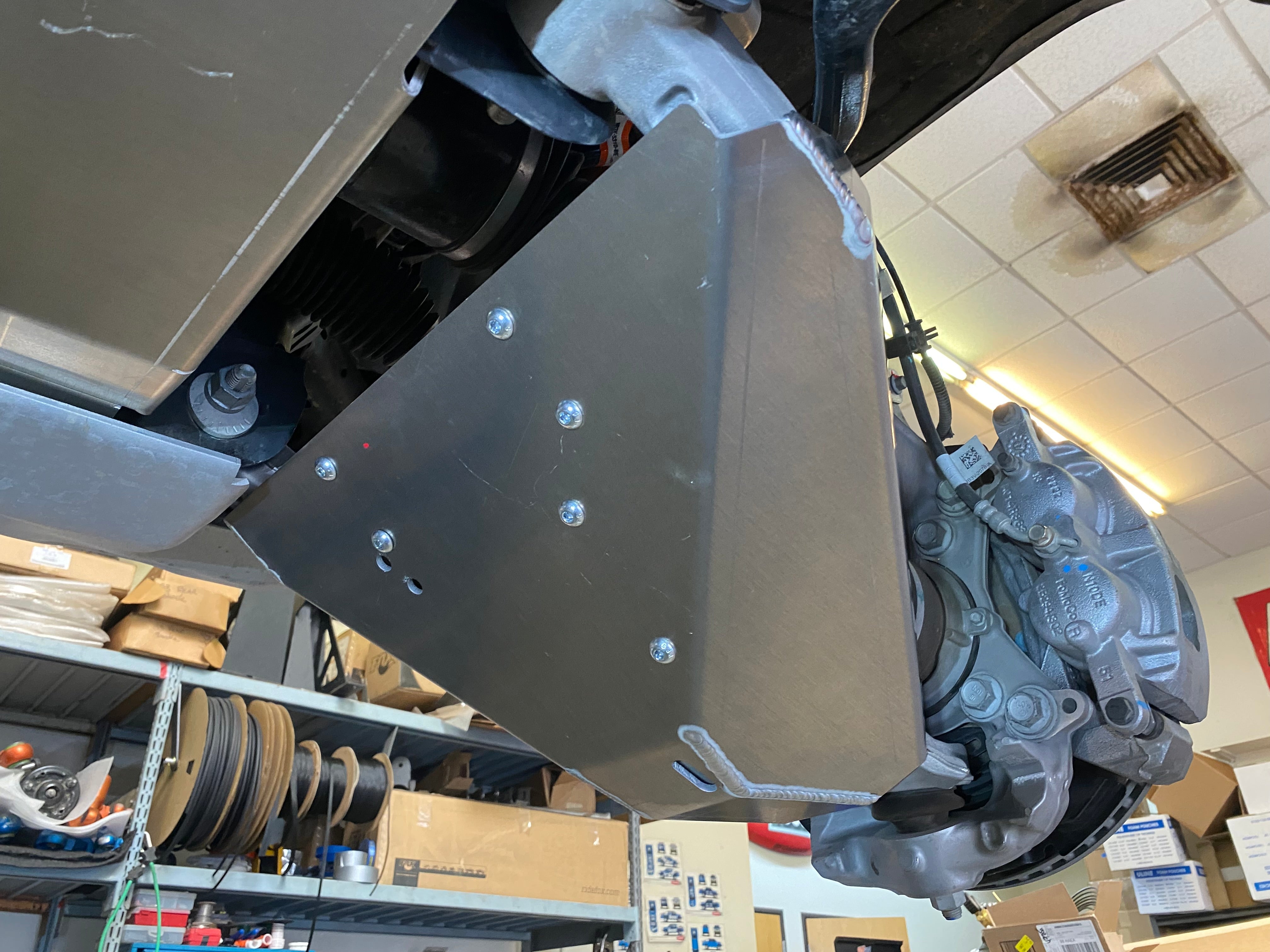 Bronco Raptor 2022 lower control arm skid plate kit installed on stock arm, showcasing durable protection for offroad use.
