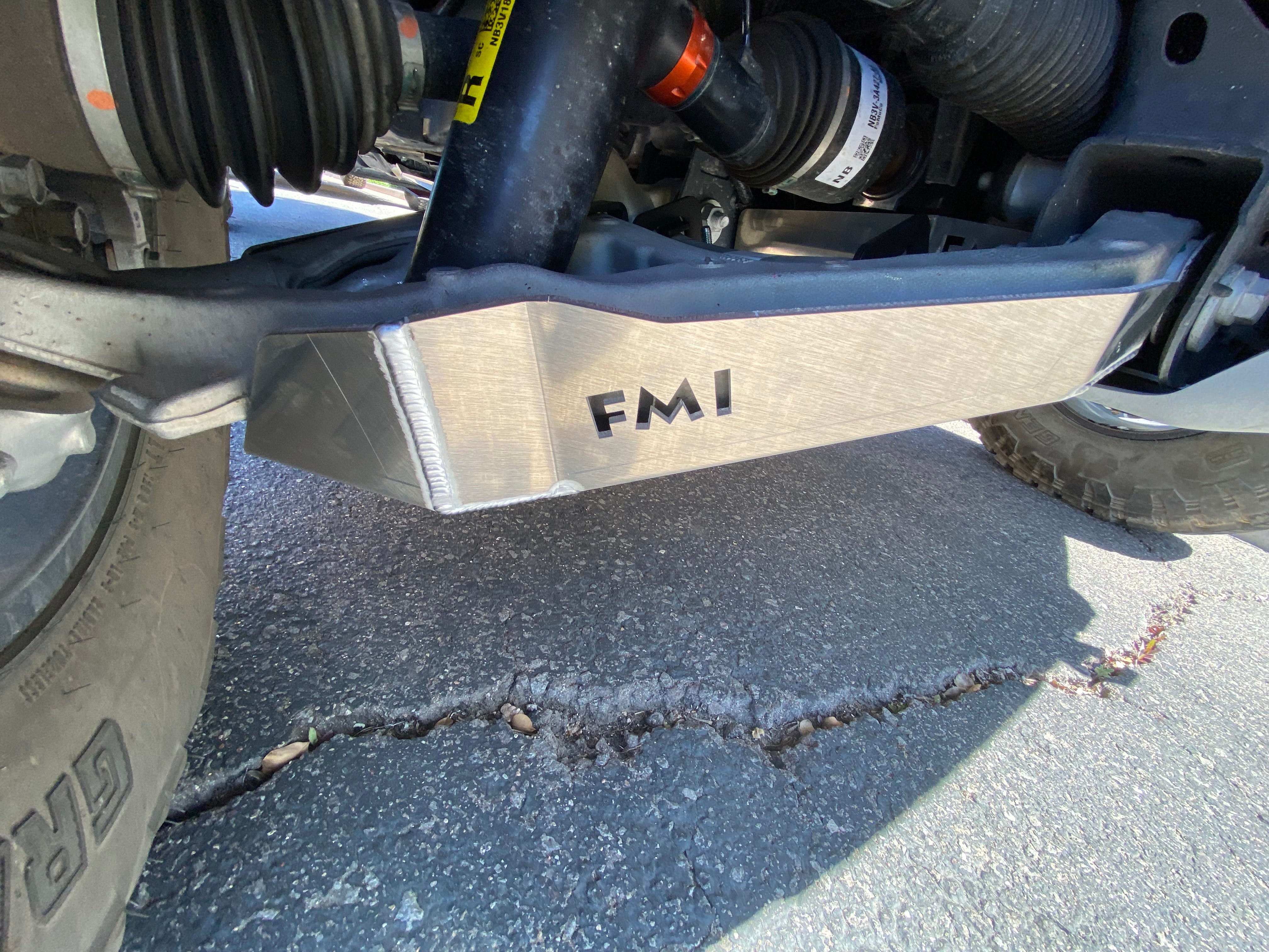 Bronco Raptor 2022 lower control arm skid plate kit installed on a vehicle, showcasing durable metal construction.
