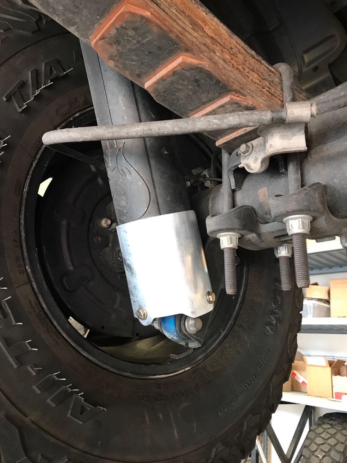 Rear shock guard for 2017-2024 Ford Raptor, designed to protect the shock absorber from damage.