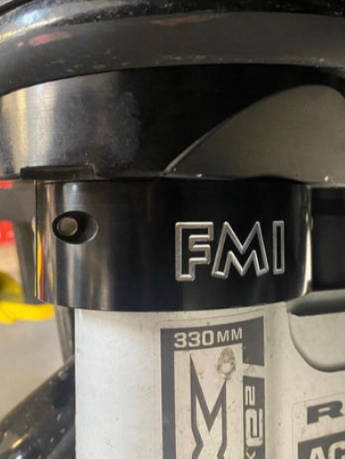 2025 Ram RHO 2.5 inch front leveling kit showcasing the FMI logo and detailed design for enhanced vehicle performance.