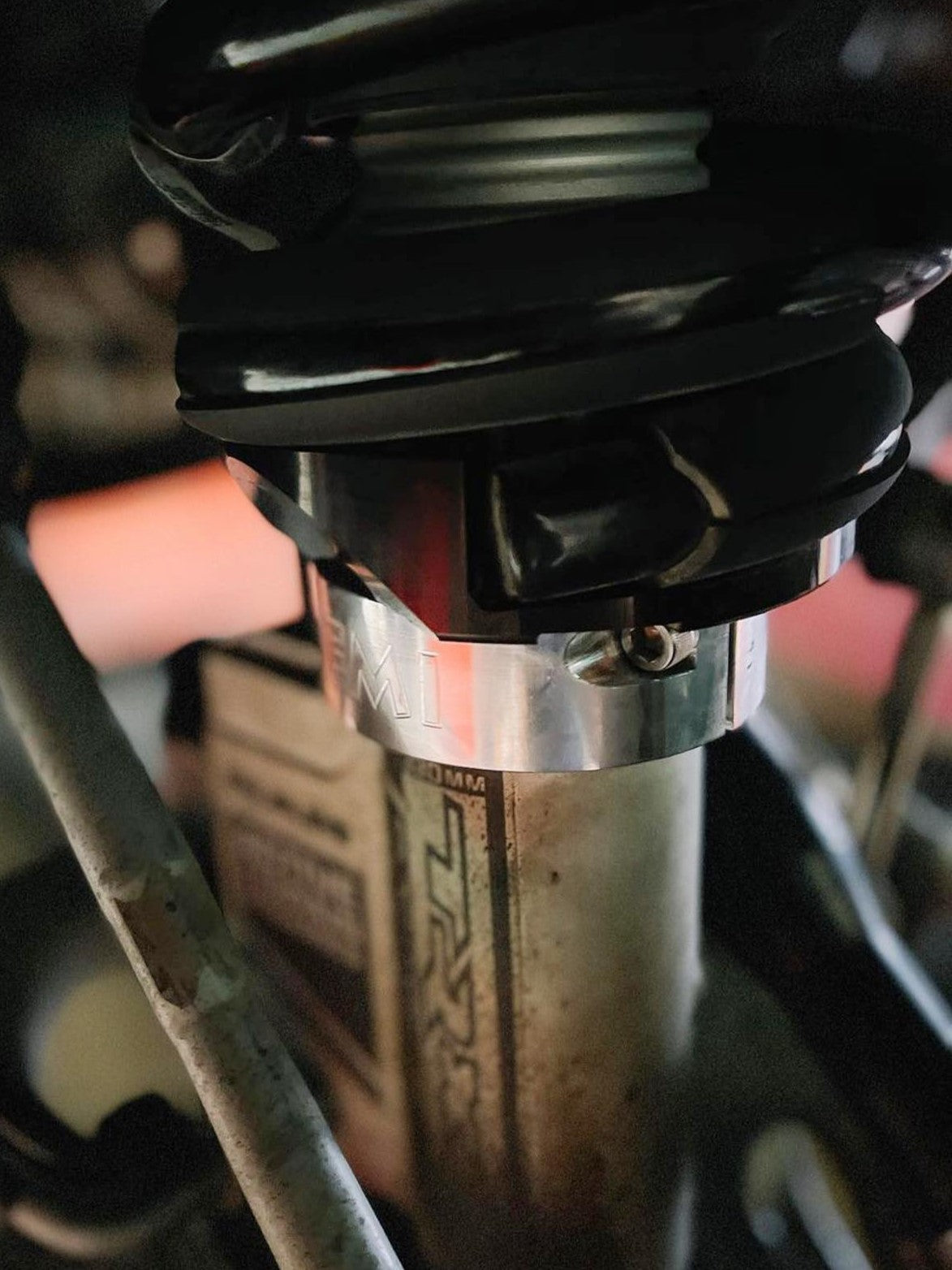 Close-up of the 2025 Ram RHO 2.5 inch front leveling kit showcasing the shock assembly and adjustment components.