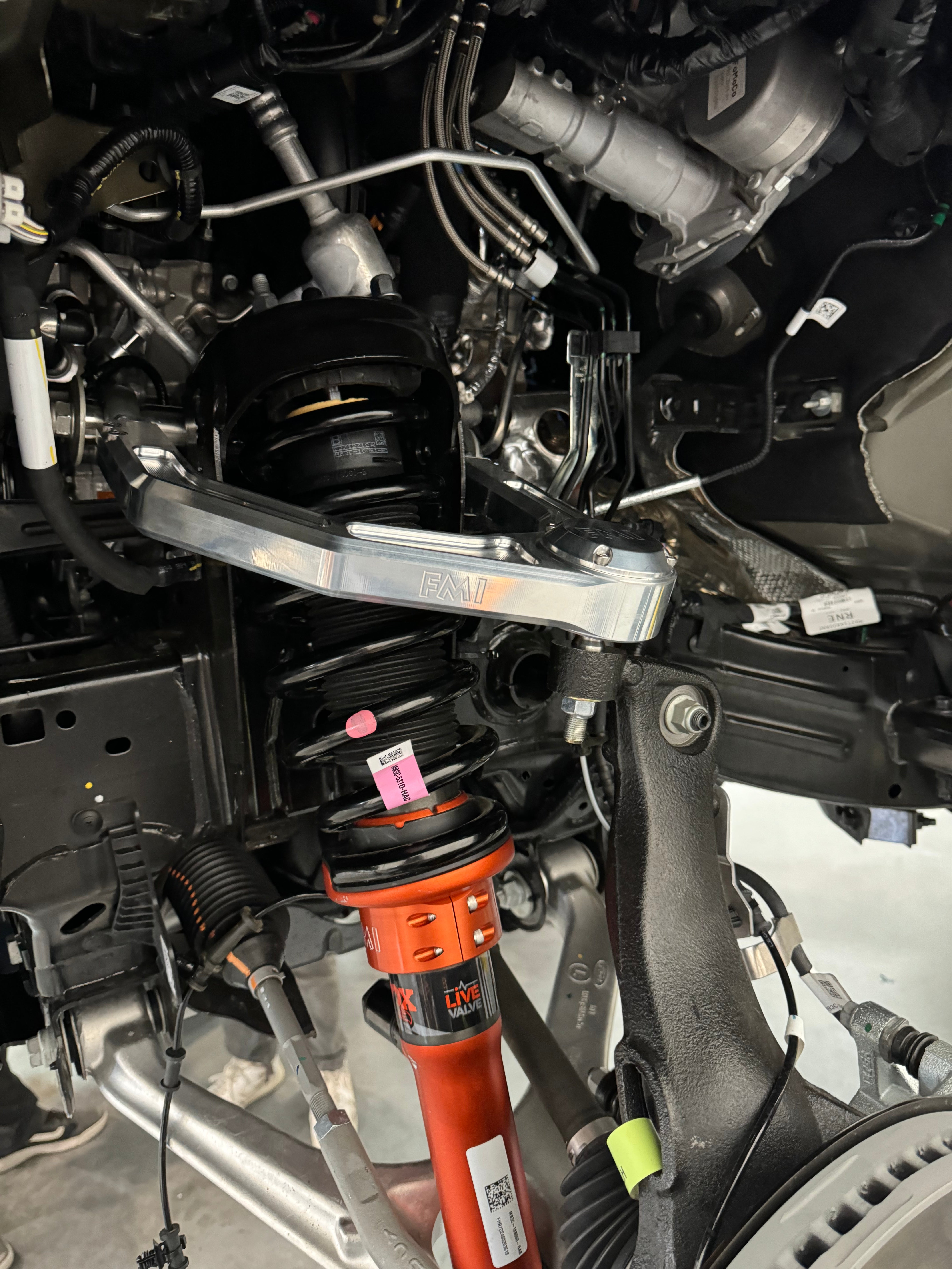 2024 Ranger Raptor billet upper control arm kit installed in a vehicle, showcasing stock length suspension components.