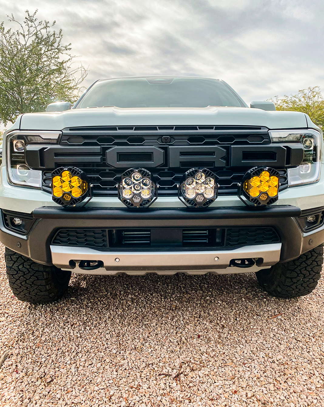 2024 Ranger Raptor Front Light Mount Kit installed on stock bumper, showcasing multiple light options for enhanced visibility.