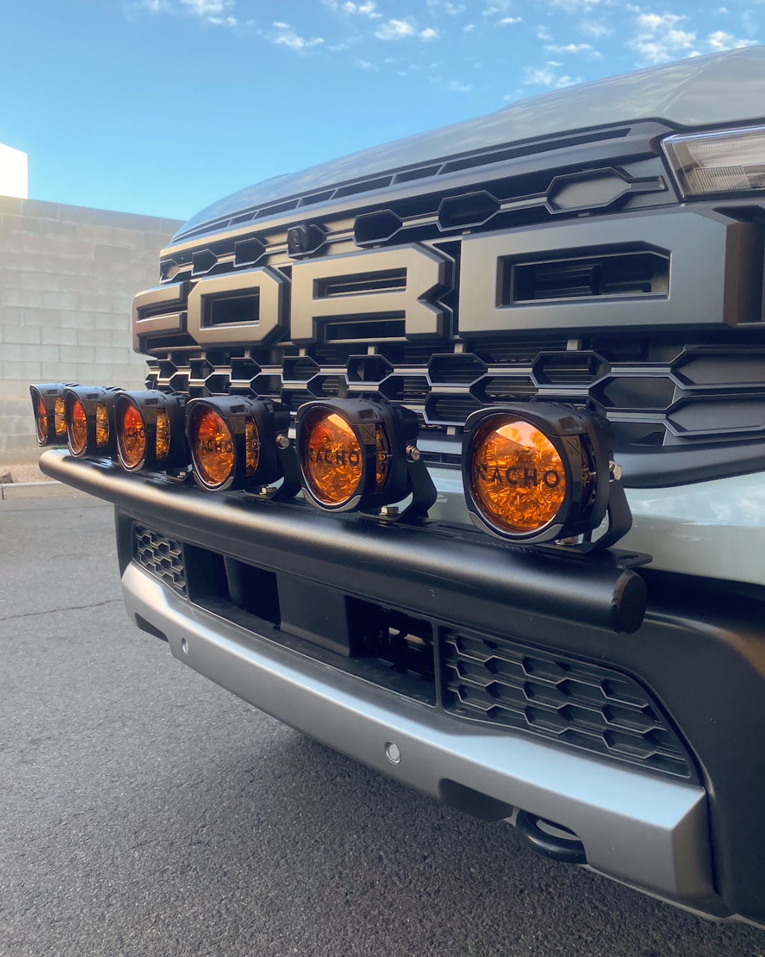 2024 Ranger Raptor Front Light Mount Kit for stock bumper, showcasing multiple orange lights mounted on the front.