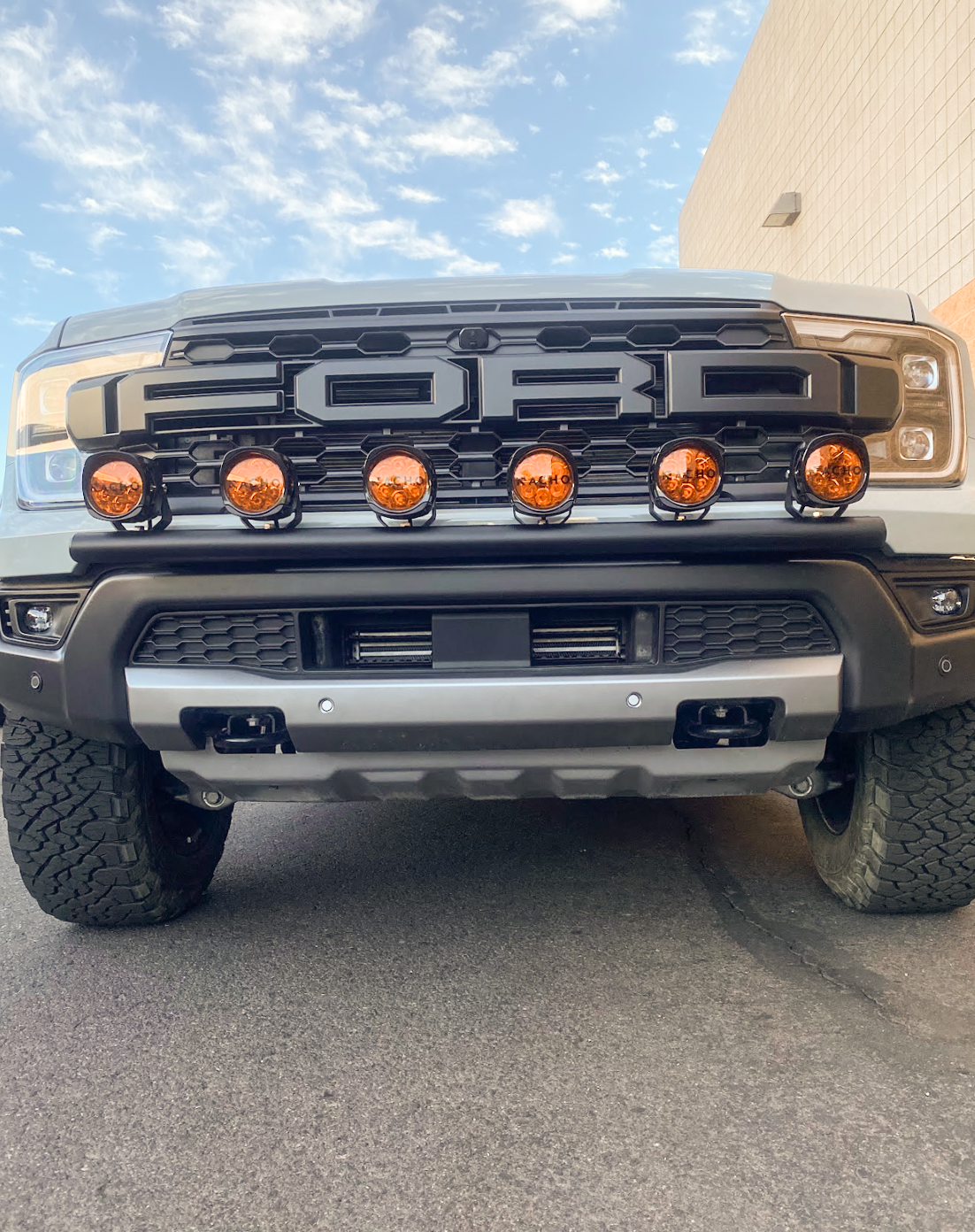 2024 Ranger Raptor front light mount kit installed on stock bumper, featuring multiple lights for enhanced visibility.