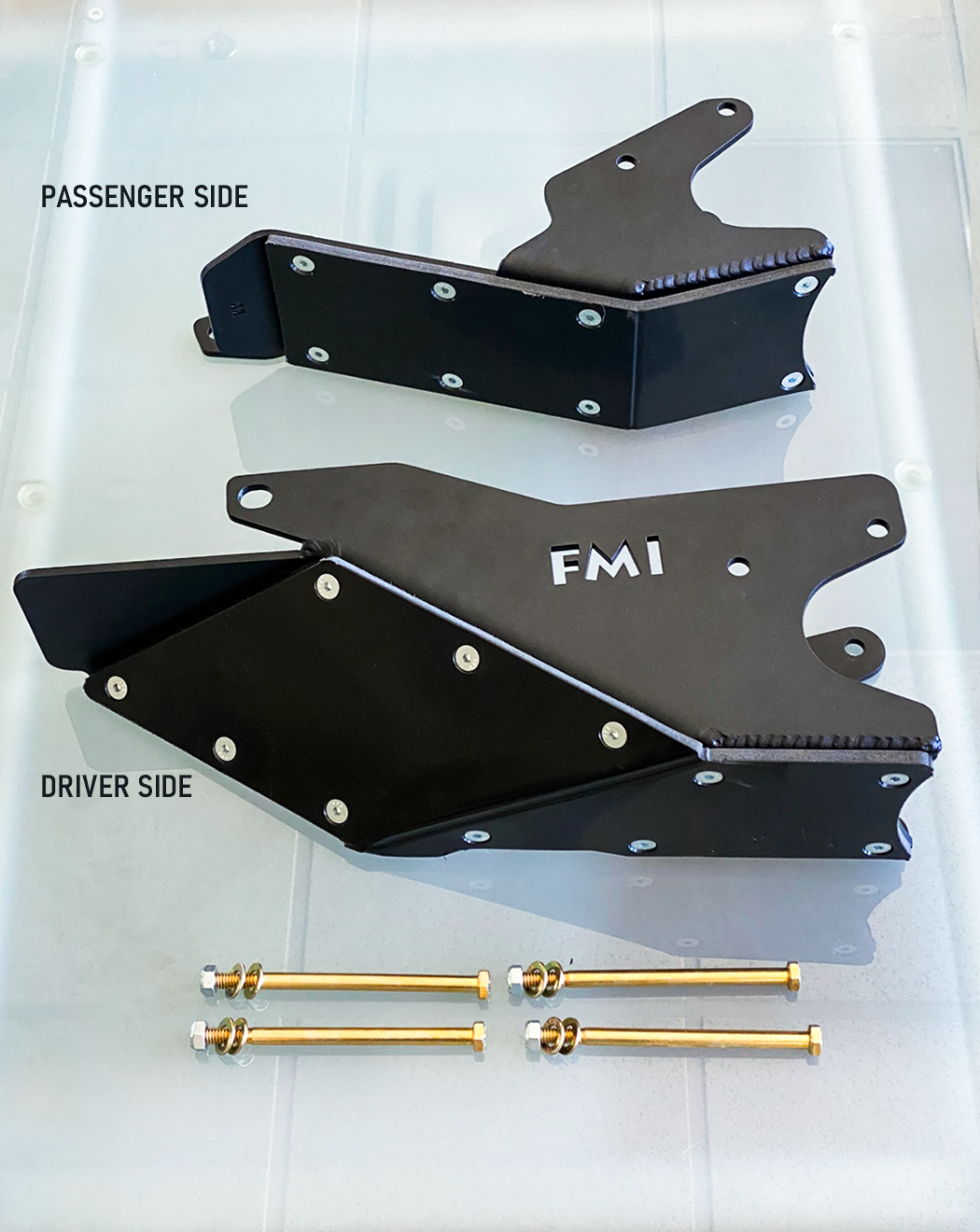2024 Ranger Raptor rear lower arm frame guard set with HDPE slide, featuring passenger and driver side components and mounting bolts.