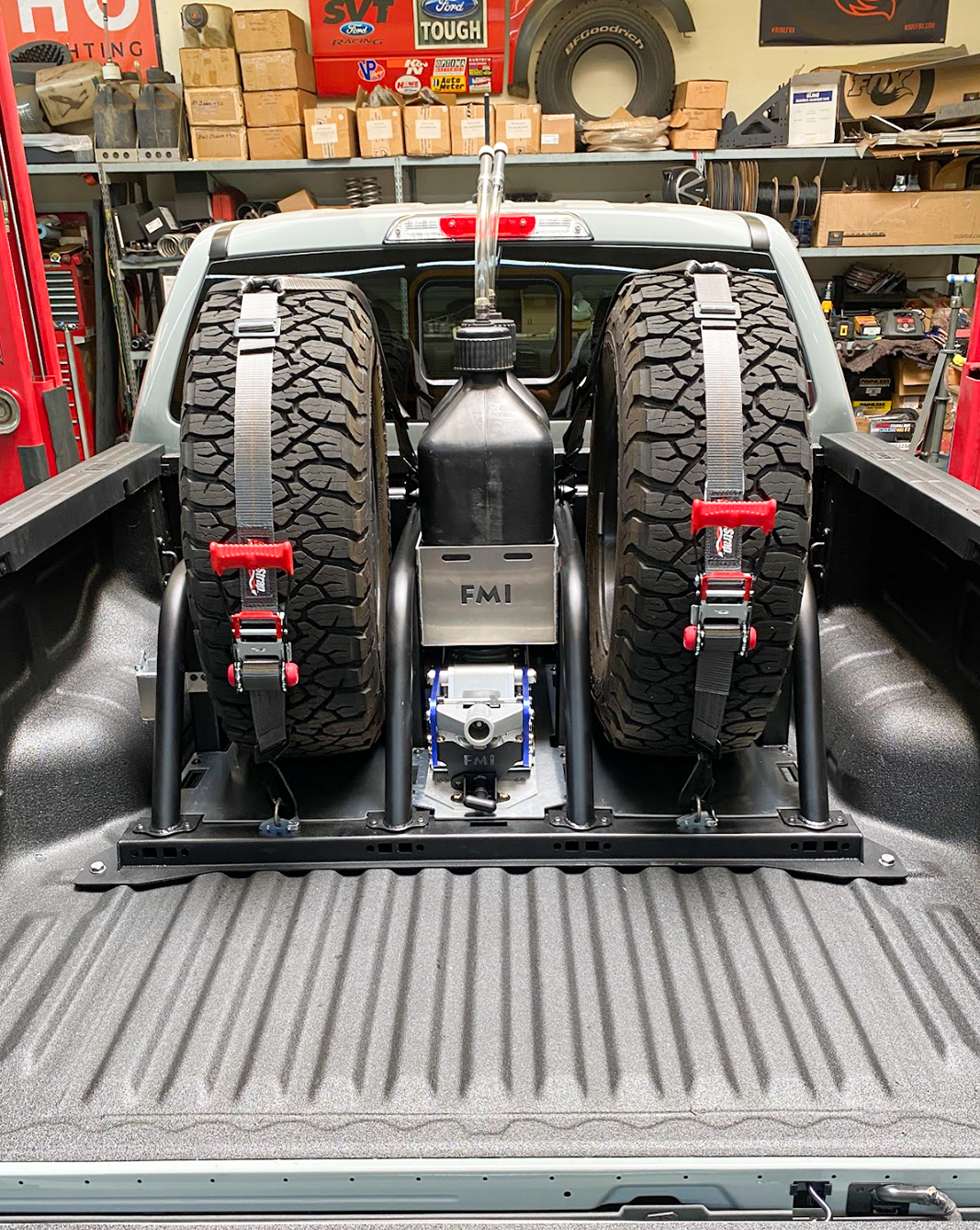 Modular bed organizer for 2024 Ranger and Ranger Raptor, featuring secure tire storage and fuel can holder in truck bed.