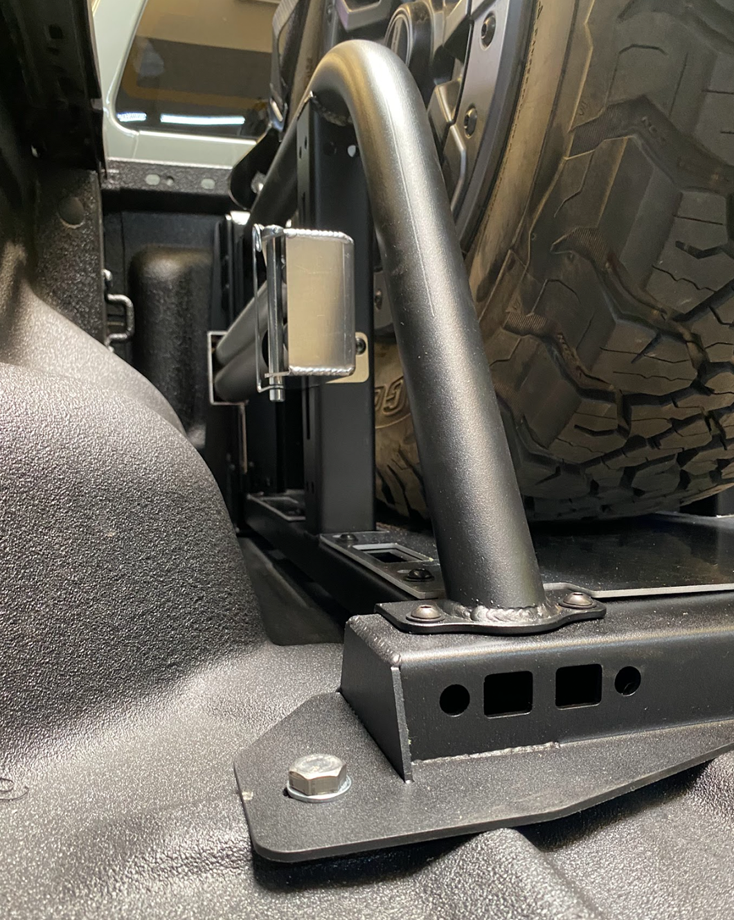 Modular bed organizer for 2024 Ranger and Ranger Raptor, showcasing durable metal construction and tire support features.