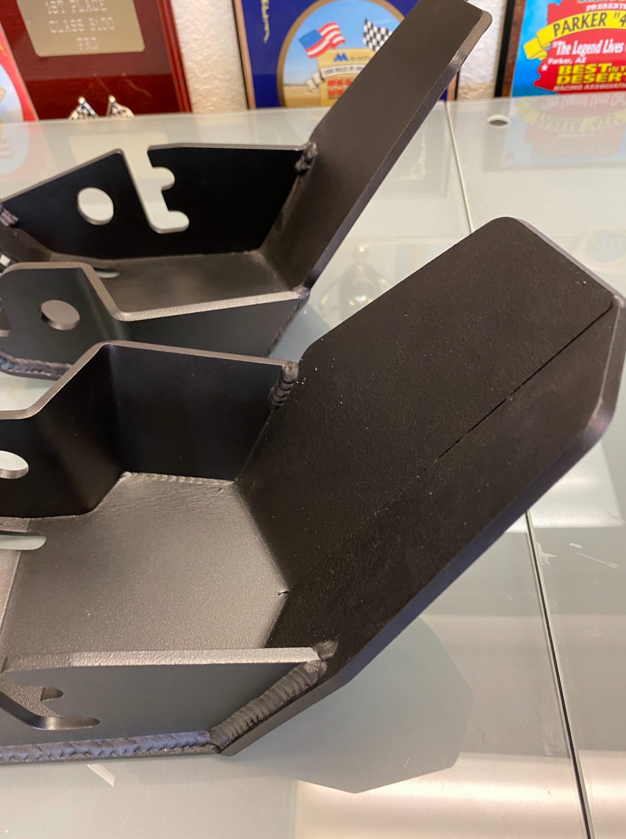 2024 Ranger Raptor rear shock skid kit showcasing durable metal construction for enhanced offroad protection.