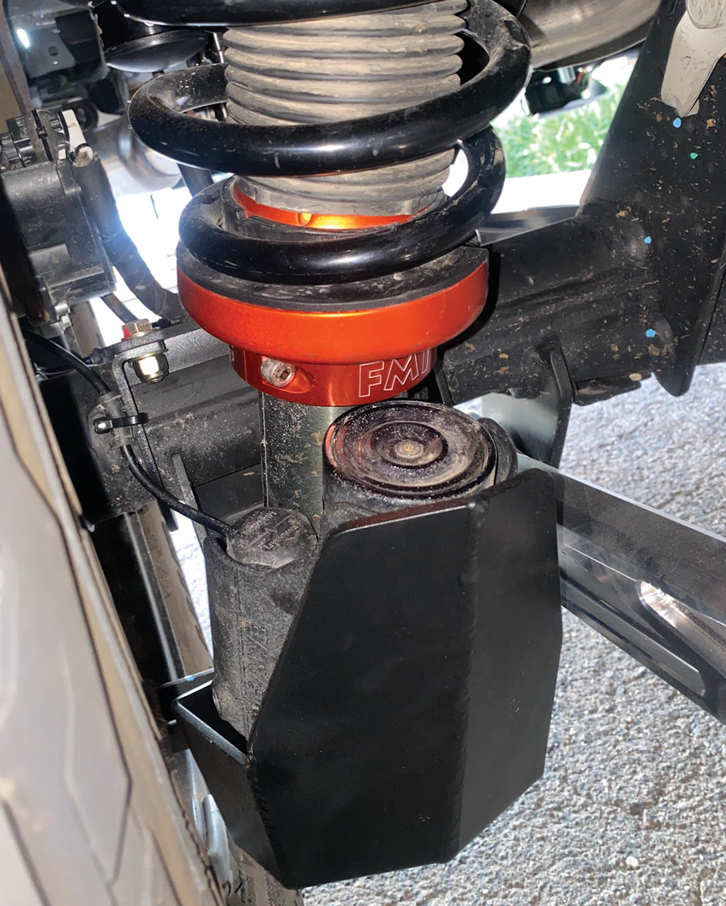 2024 Ranger Raptor rear shock skid kit installed, showcasing the shock absorber and protective skid plate.