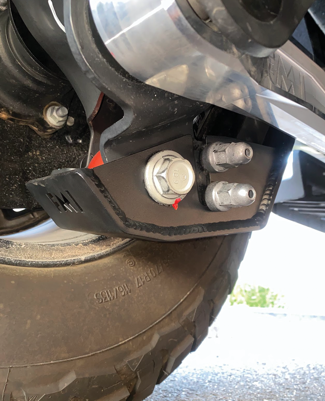 2024 Ranger Raptor rear shock skid kit showcasing durable metal construction and mounting hardware for offroad protection.