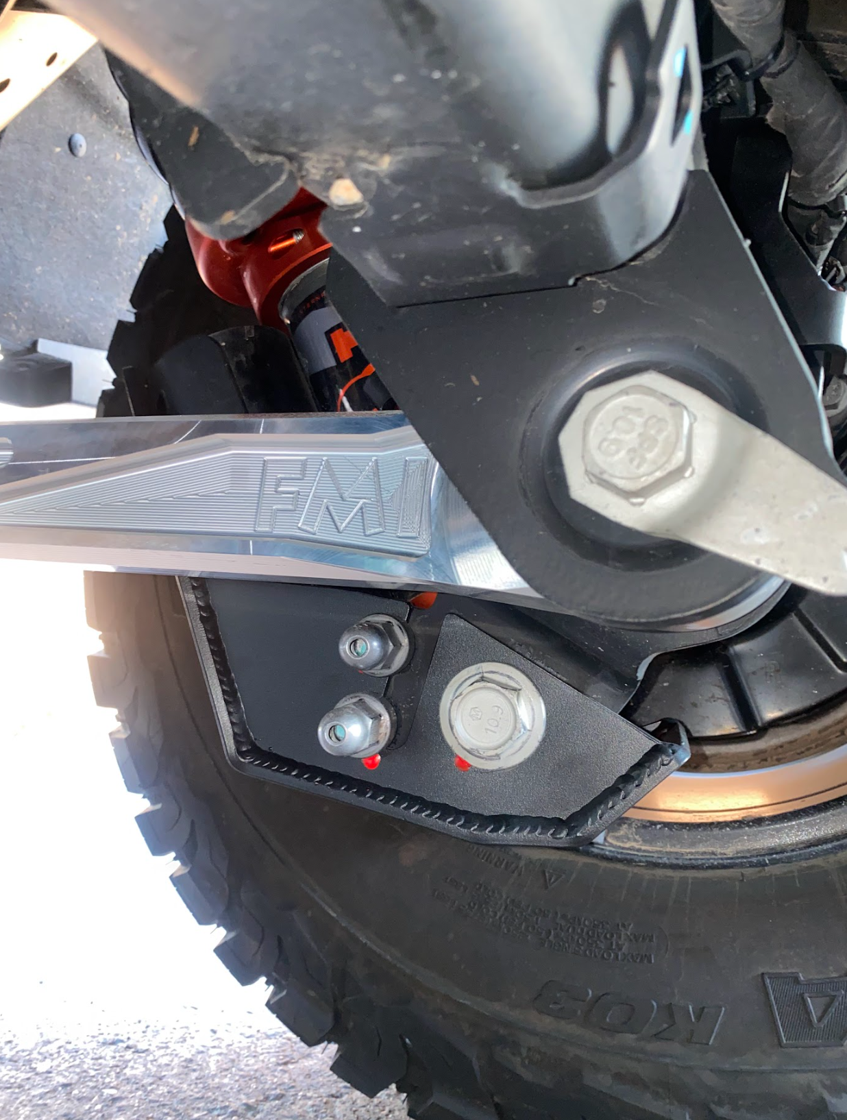 2024 Ranger Raptor rear shock skid kit showcasing durable metal construction and secure mounting for offroad protection.