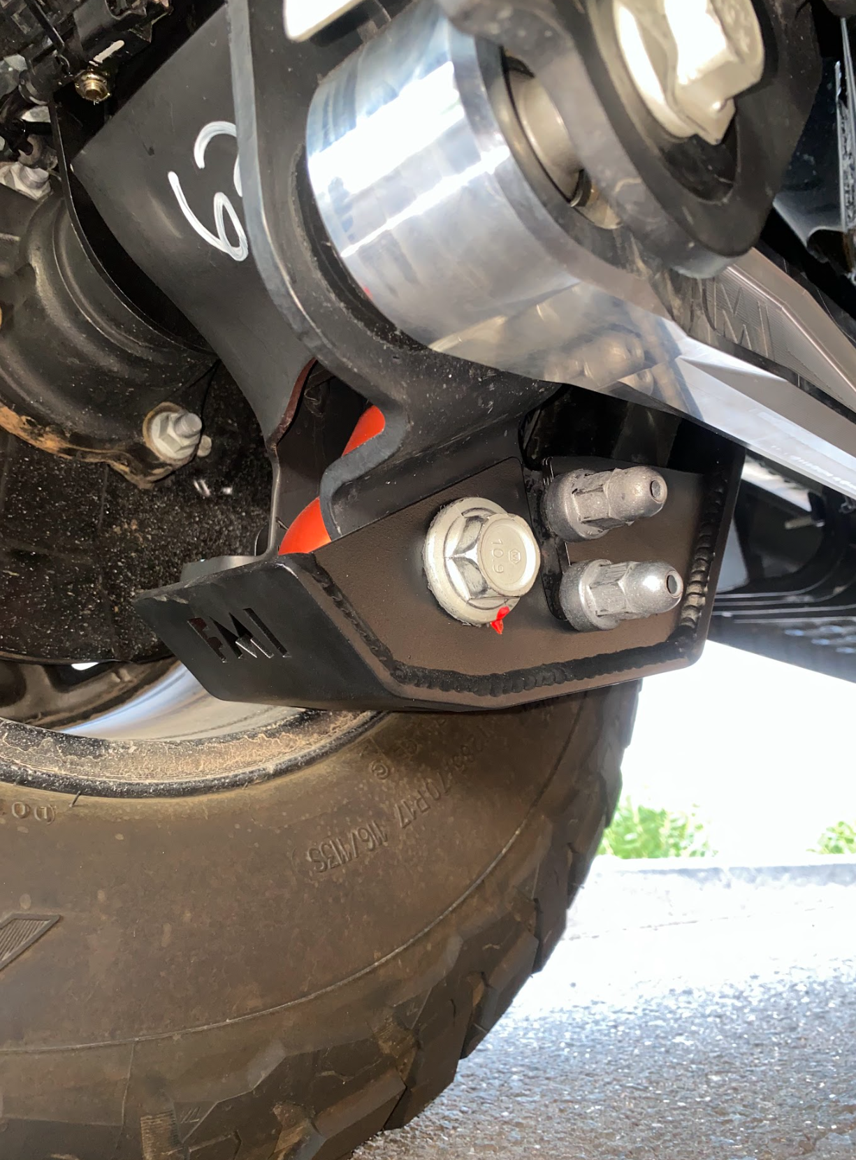 2024 Ranger Raptor rear shock skid kit showcasing durable metal construction and mounting points for enhanced protection.