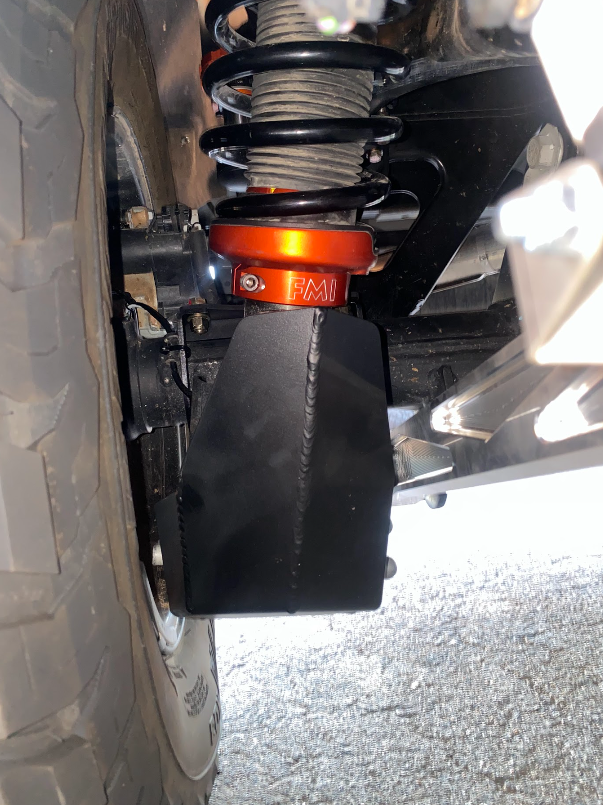 2024 Ranger Raptor rear shock skid kit installed, showcasing durable protection for offroad performance.