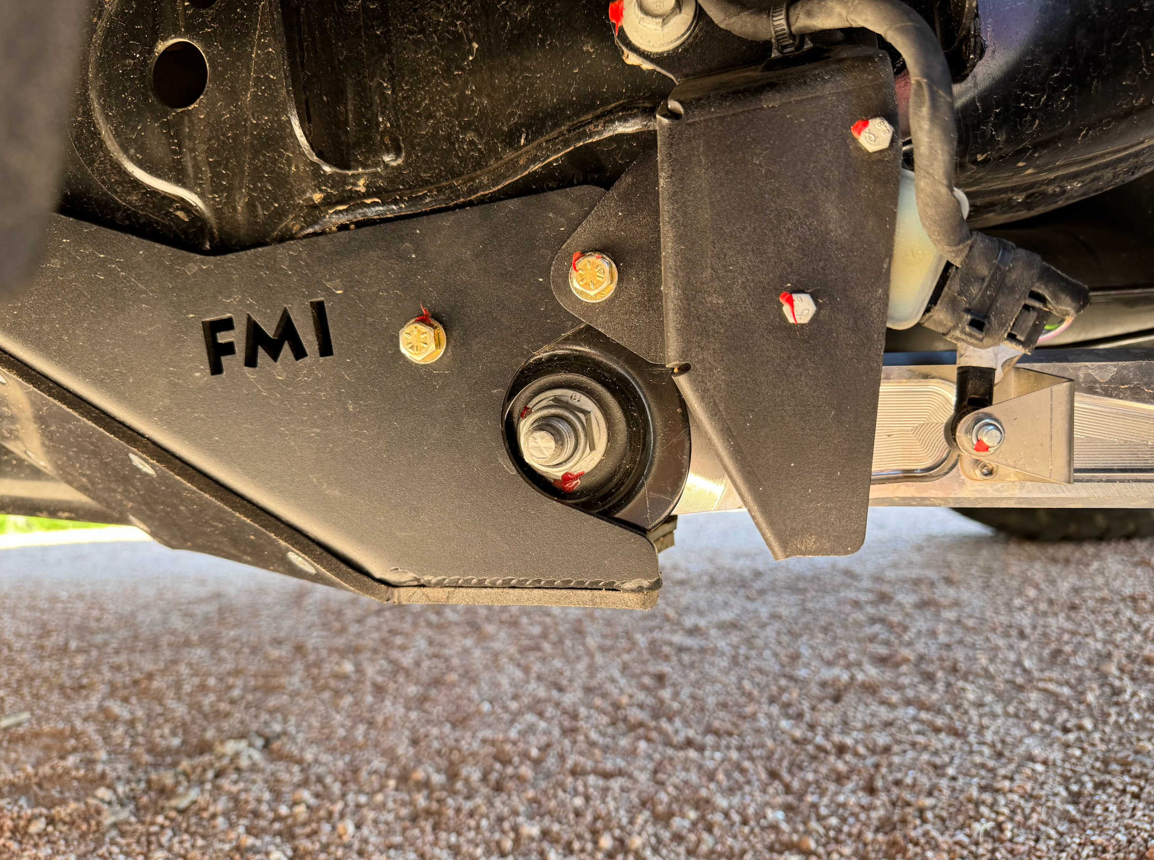 Rear suspension travel sensor protection guard for 2024+ Ranger Raptor, showcasing durable design and installation details.
