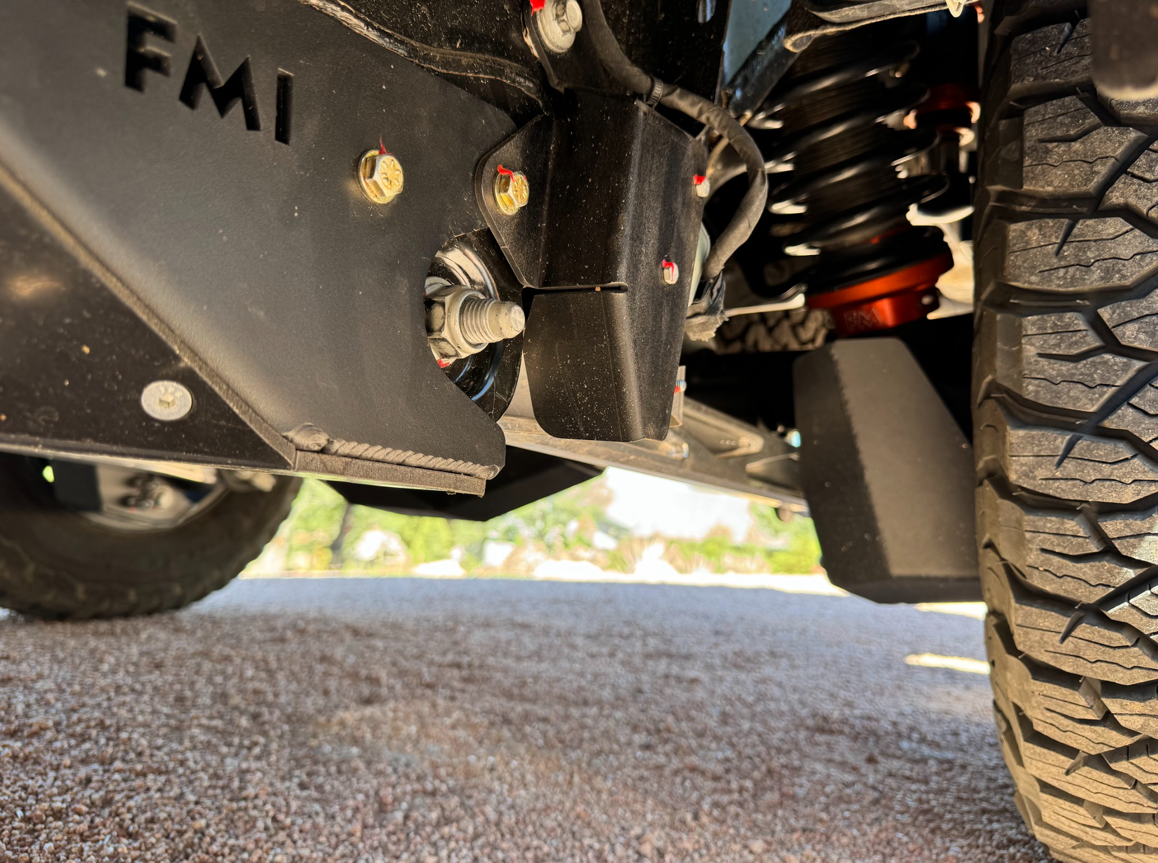 Rear suspension travel sensor protection guard for 2024 Ranger Raptor, showcasing durable design and installation details.