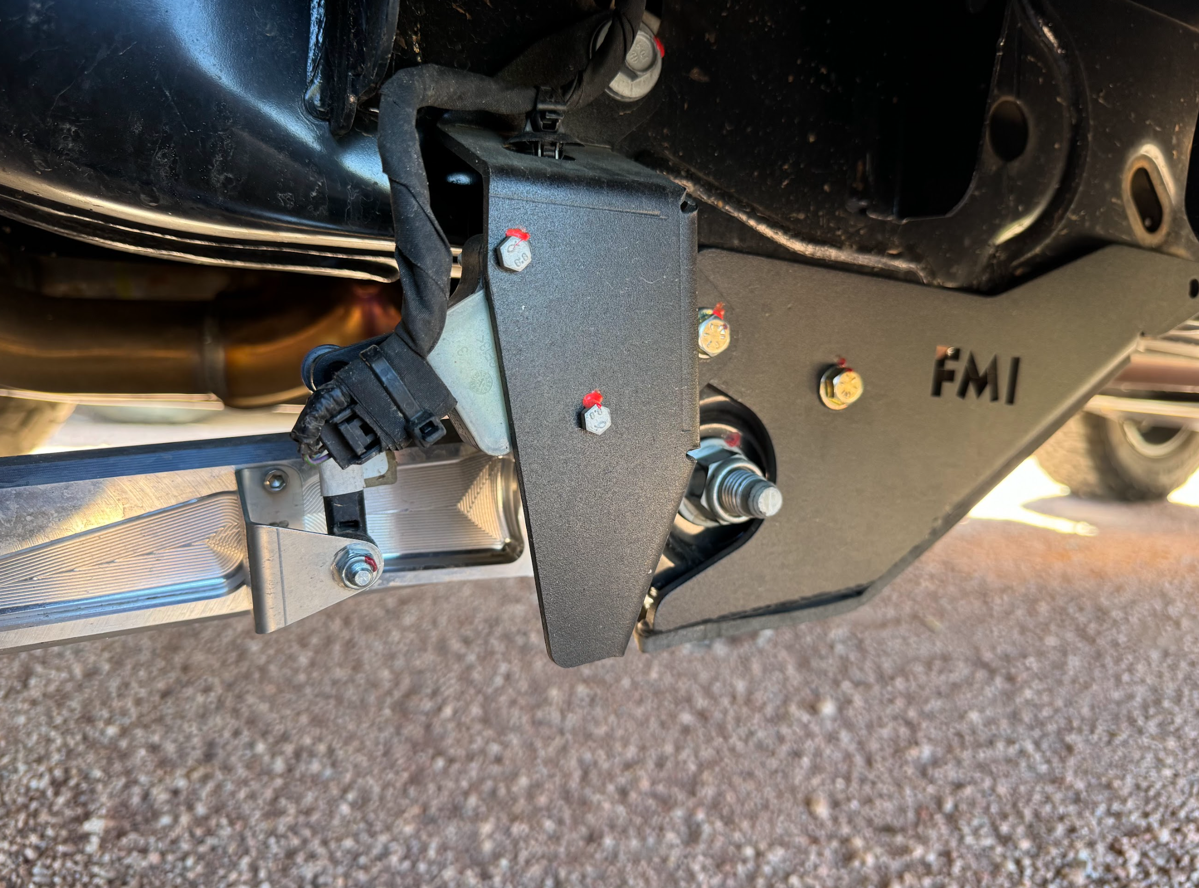 Rear suspension travel sensor protection guard for 2024 Ranger Raptor, showcasing durable design and installation features.