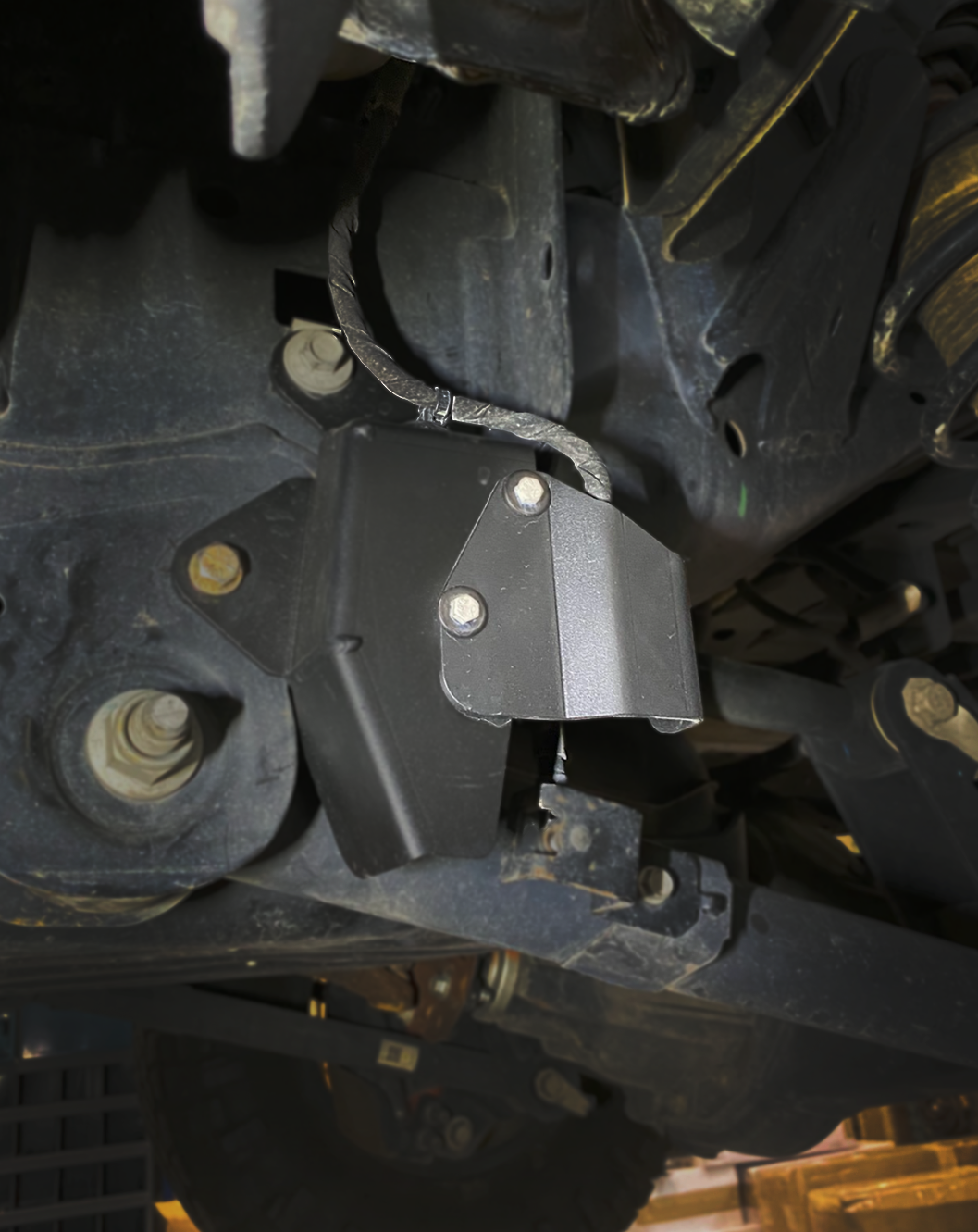 Rear suspension travel sensor wire protector for 2024+ Ranger Raptor, enhancing durability and protection for off-road use.