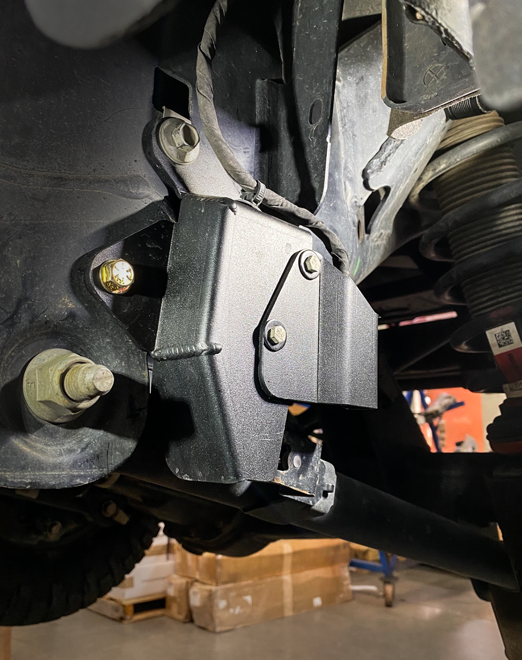 Rear suspension travel sensor wire protector for 2024 Ranger Raptor, enhancing durability and protection against damage.
