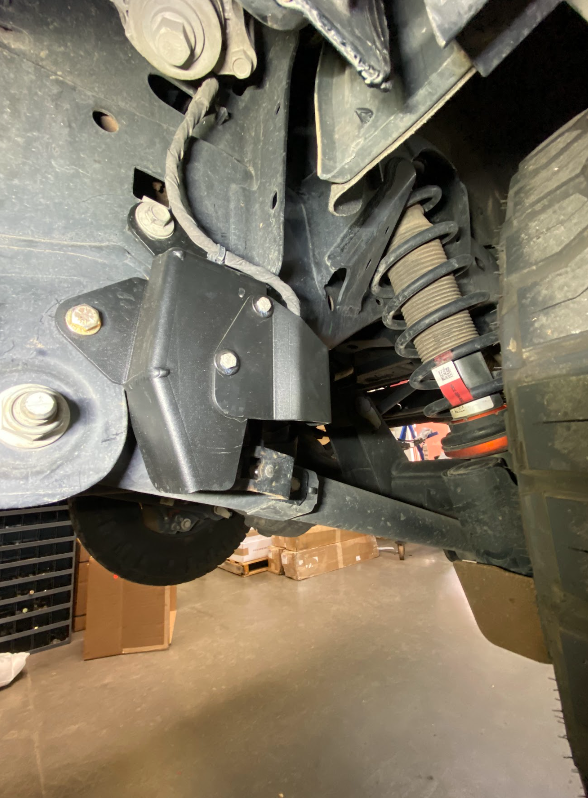 Rear suspension travel sensor wire protector for 2024 Ranger Raptor, enhancing durability and protection in off-road conditions.
