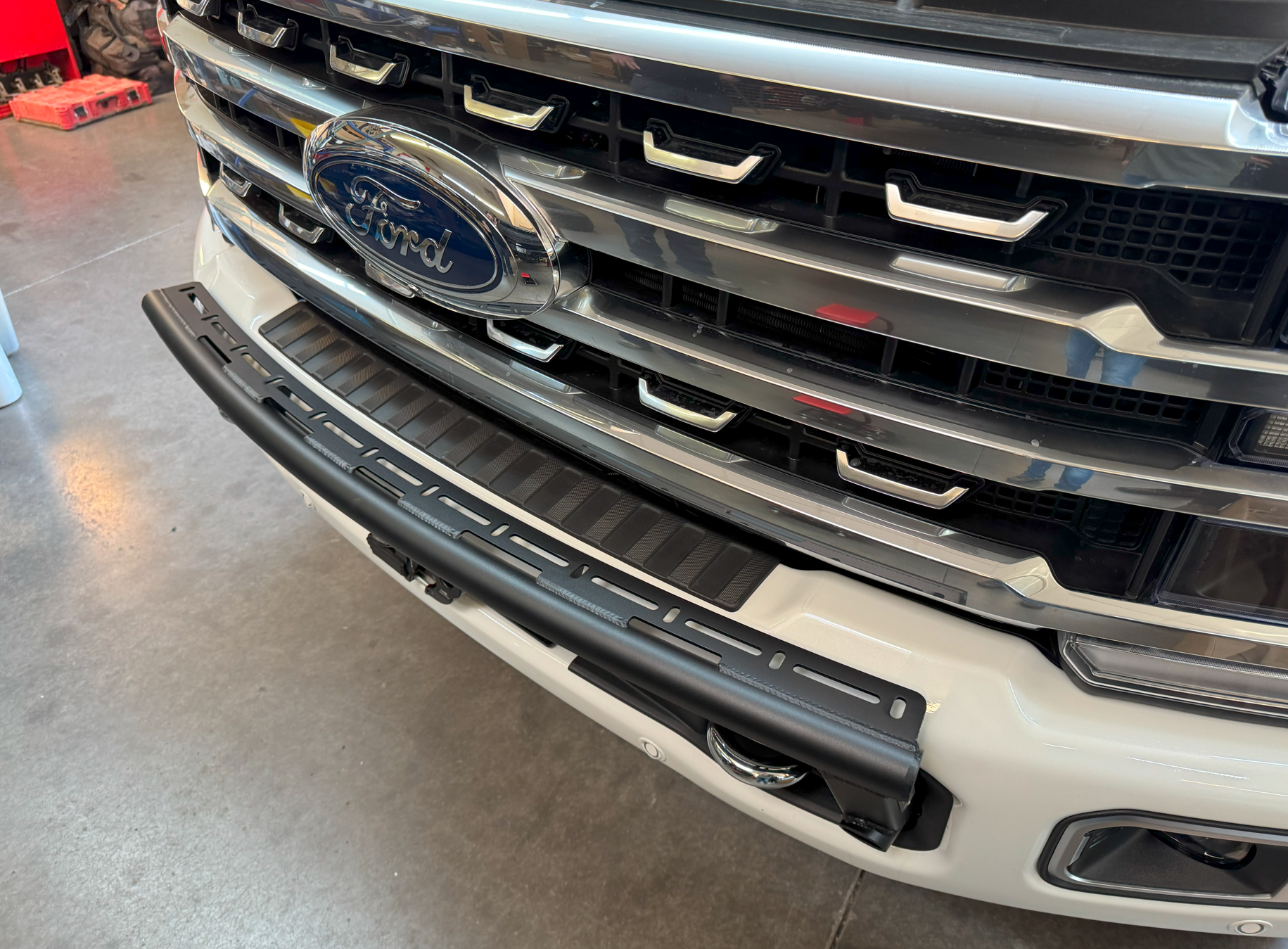 Front light mount kit for 2023+ Ford F-250 Super Duty, designed for stock bumpers, showcasing durable black finish.