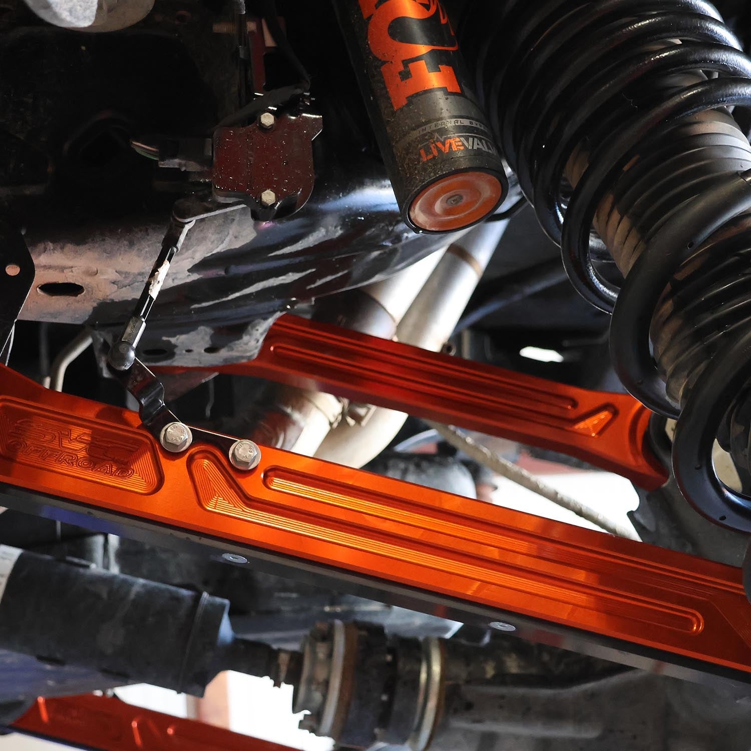 2023+ Bronco Raptor rear billet links showcasing durable orange aluminum construction for enhanced offroad performance.