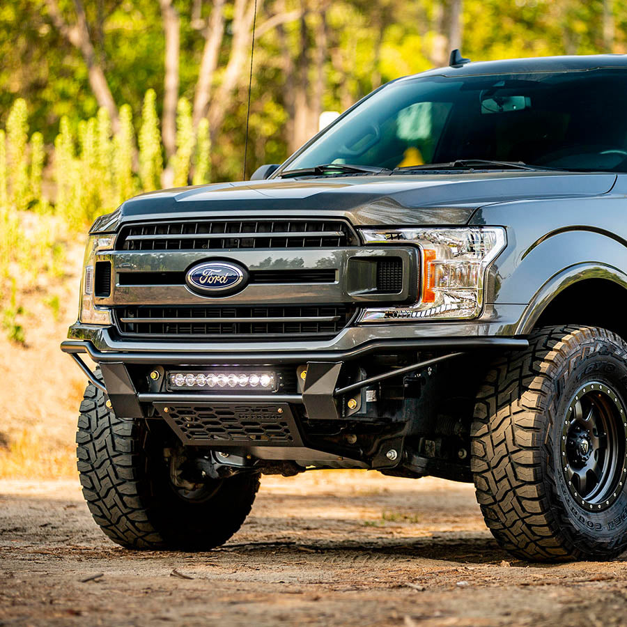 2018-2020 F-150 Baja bolt-on bumper showcasing rugged design and integrated LED lights for enhanced off-road performance.