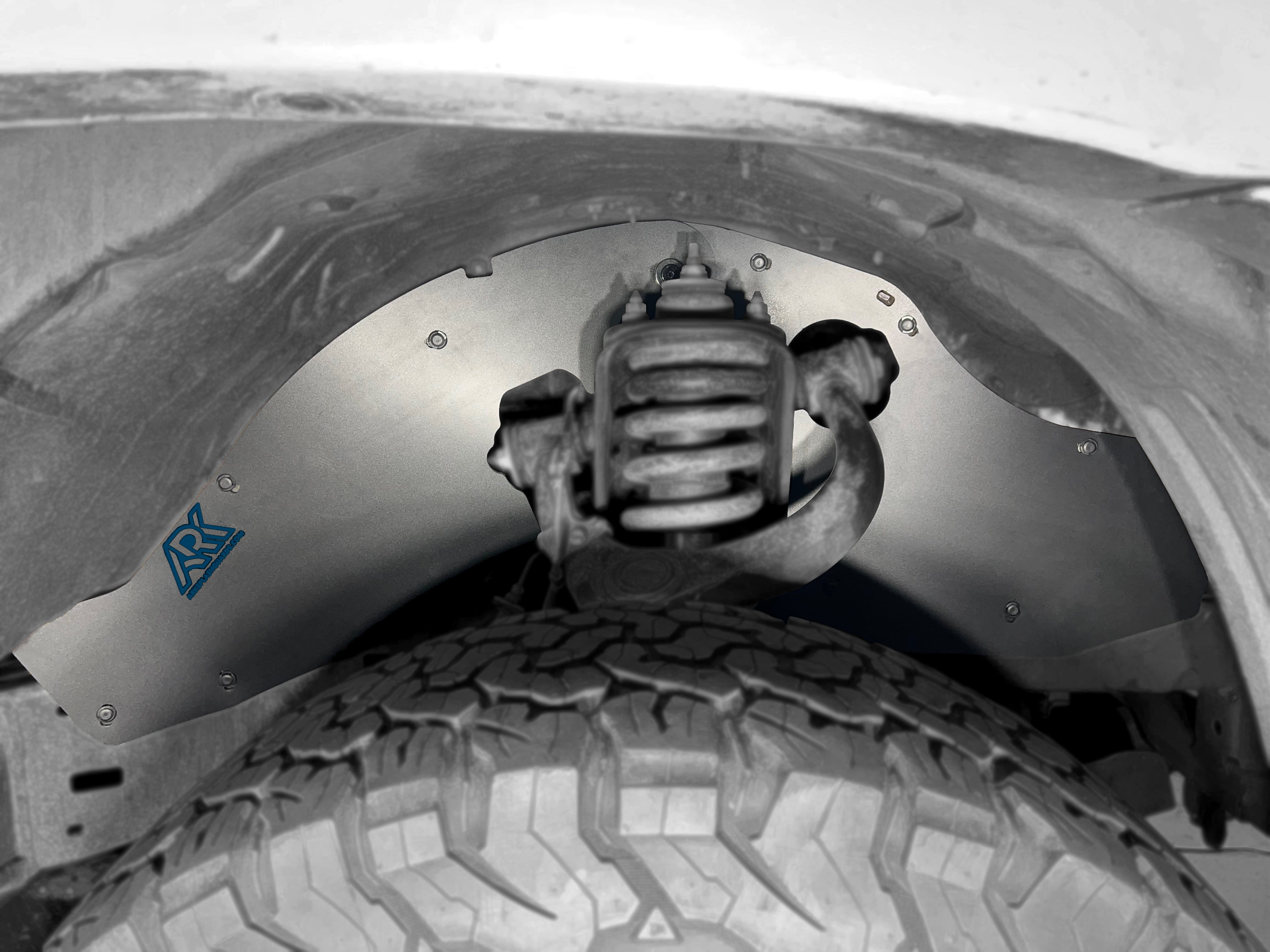 TriXpoly splash guards for 2005-2015 Toyota Tacoma, showcasing durable protection for wheel wells and suspension components.