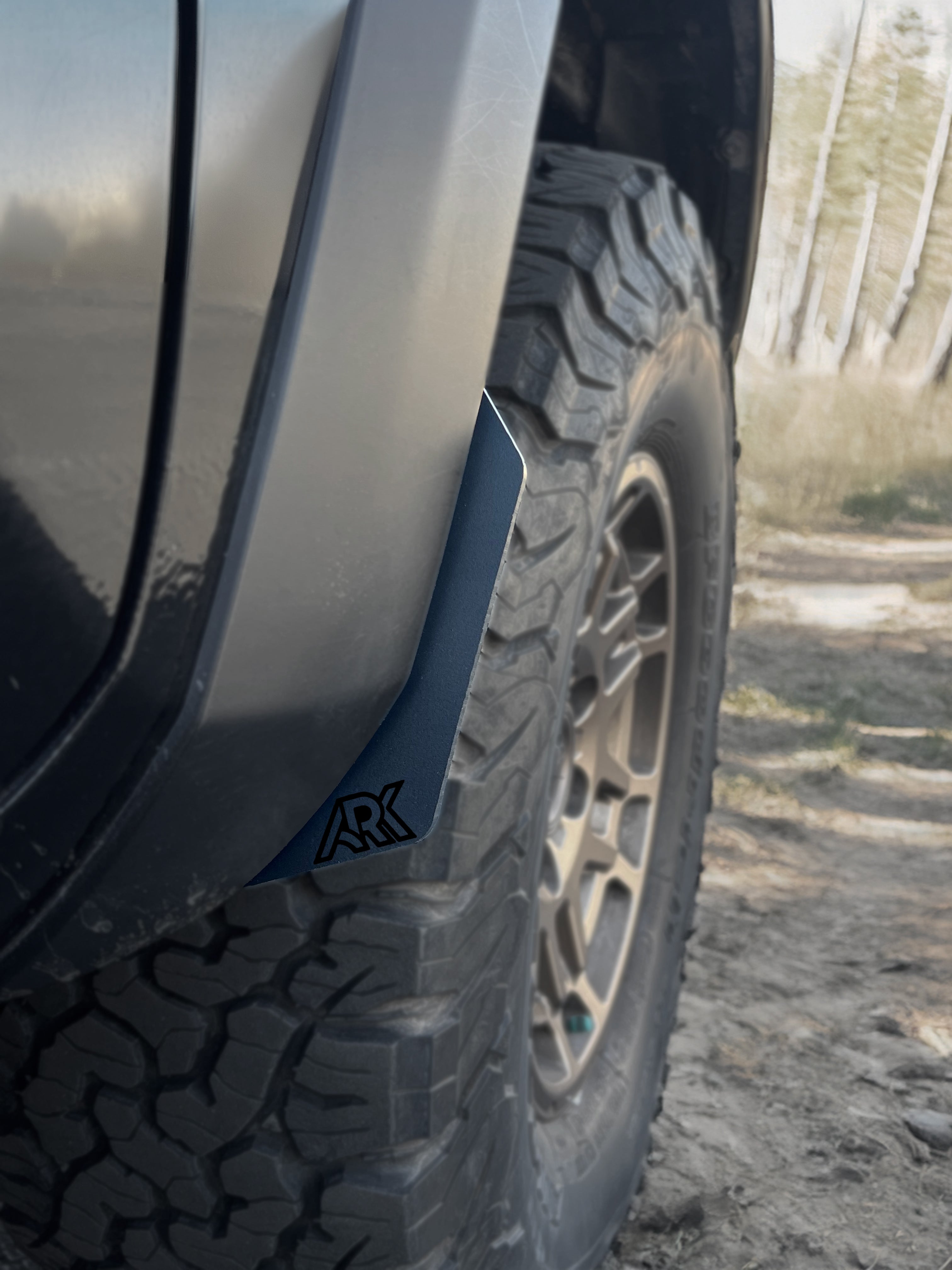 TriXpoly splash guards and mudflaps for 2016-2023 Toyota Tacoma, designed for offroad protection and durability.