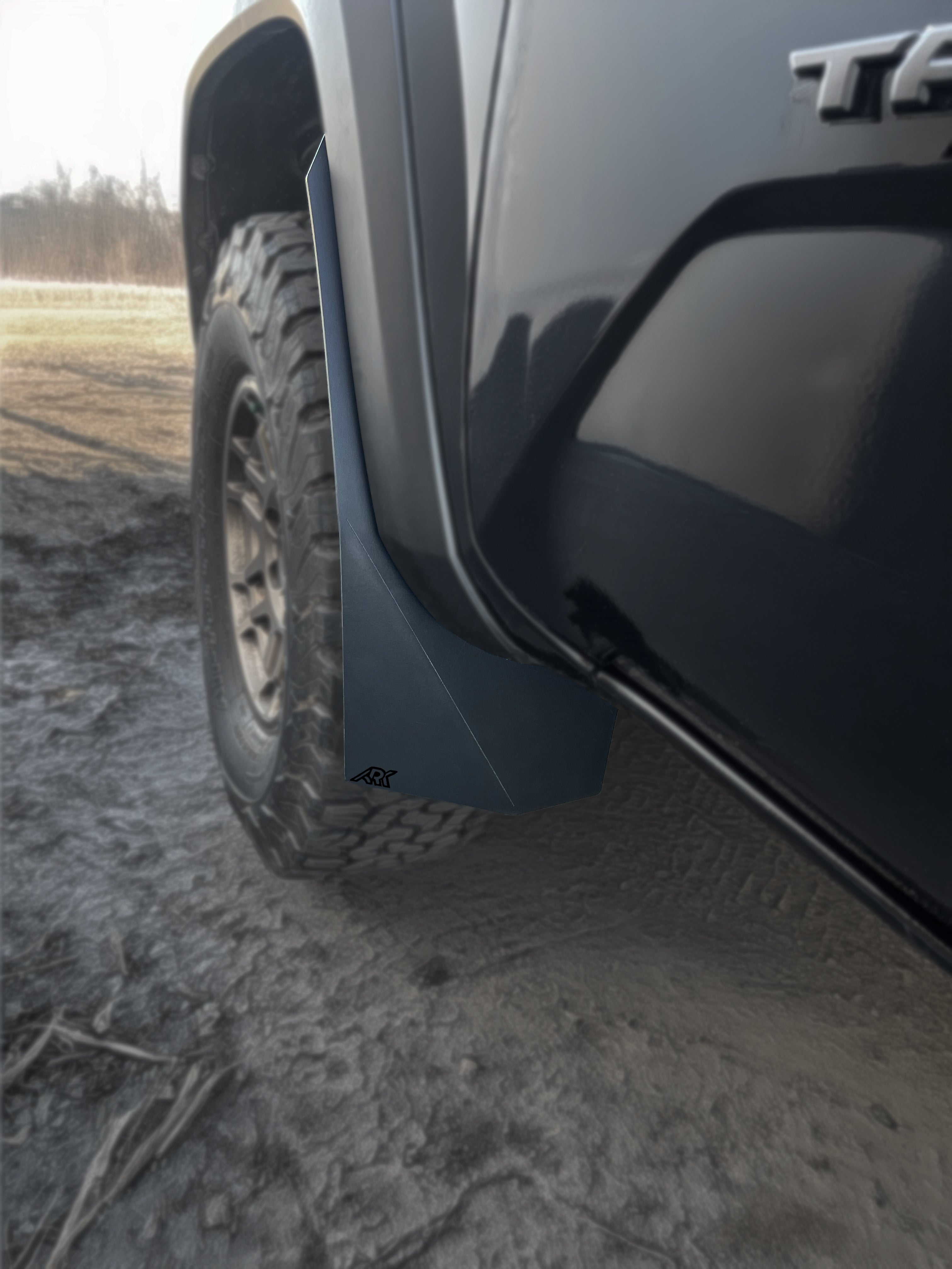 TriXpoly splash guards and mudflaps for 2016-2023 Toyota Tacoma, designed for durability and protection against mud and debris.