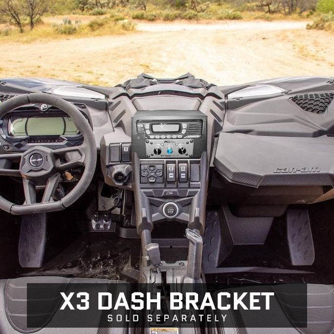 Interior view of a Can Am X3 showcasing the Trax Communications Package with controls and dashboard features.