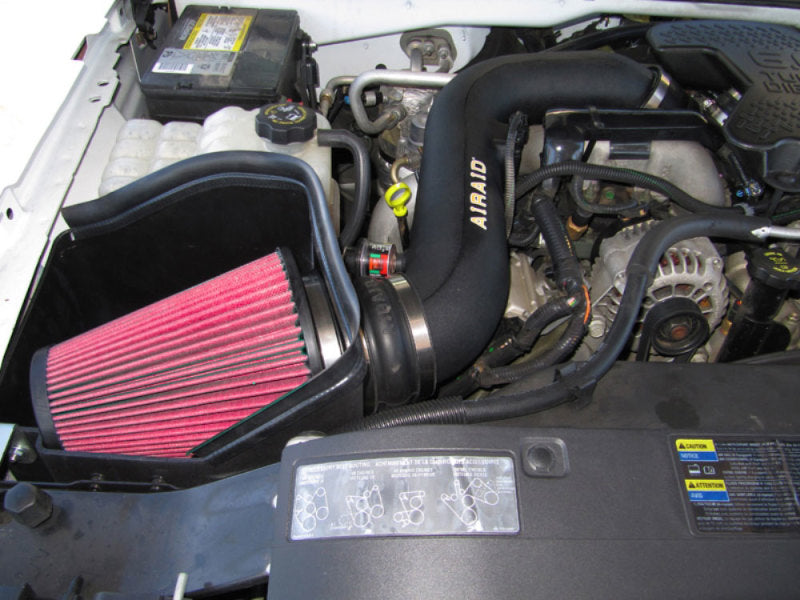 Airaid MXP intake system installed in a 2004-2005 GM 2500/3500 pickup with a 6.6L diesel engine, featuring a red air filter.