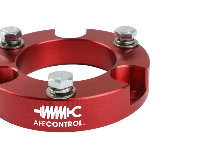 aFe CONTROL 2.0 inch leveling kit for 2005-2021 Toyota 4Runner, FJ Cruiser, and Tacoma in red with bolts.