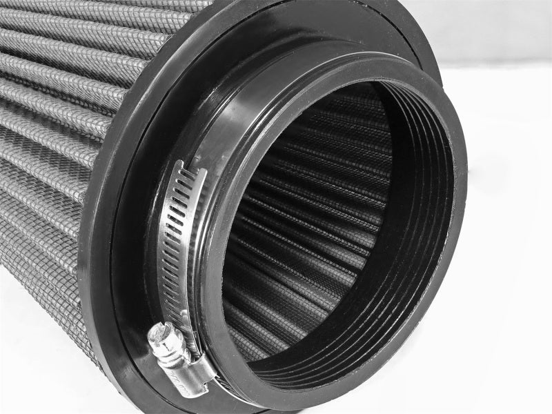 aFe MagnumFLOW air filter featuring a cylindrical design with pleated media and a black rubber base for secure installation.