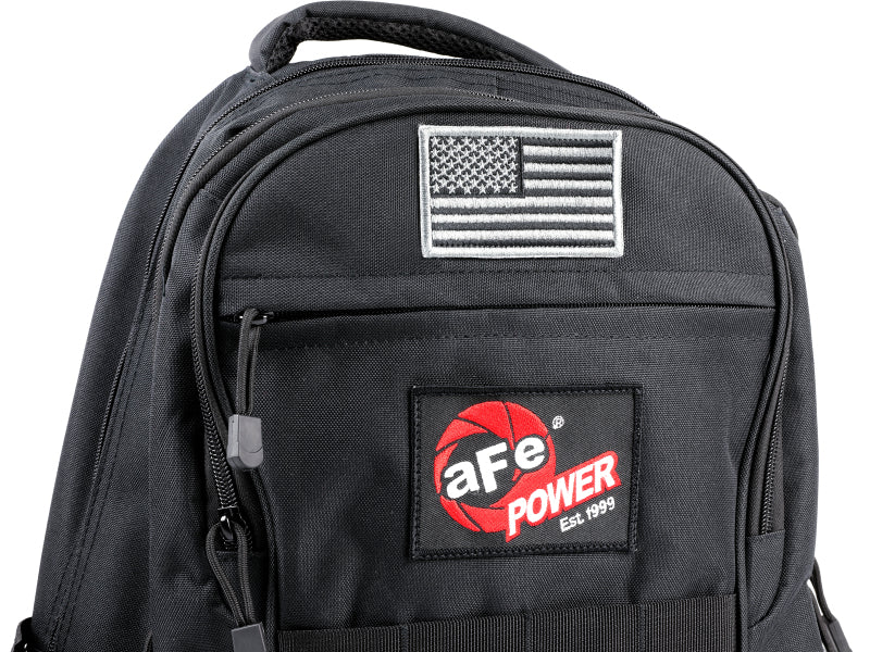 aFe Power Lightweight Tactical Backpack in black featuring a USB charging port and American flag patch on the front.