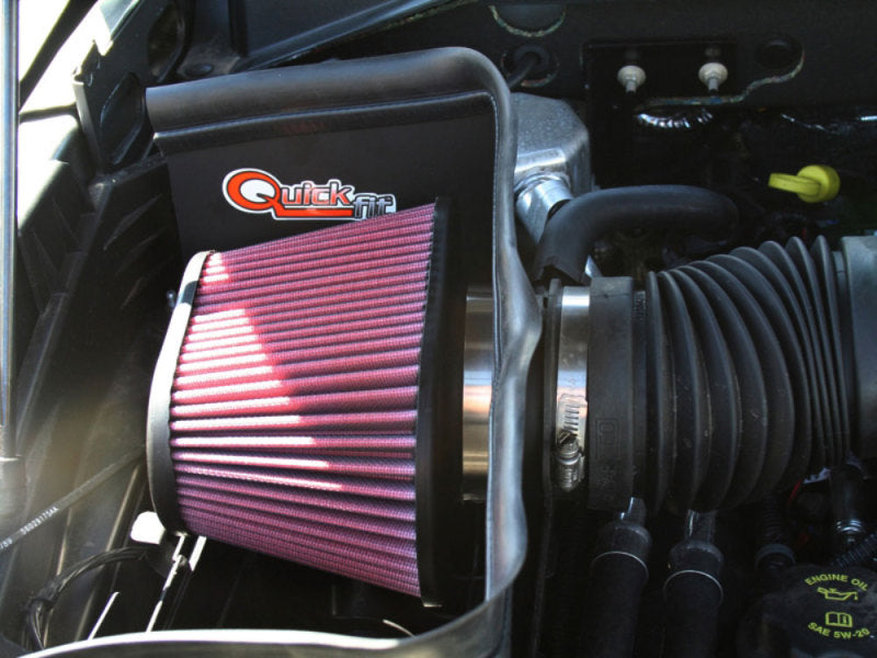 Airaid intake system for 05-11 Dodge Dakota and 06-09 Mitsubishi Raider featuring oiled red media filter and installation components.