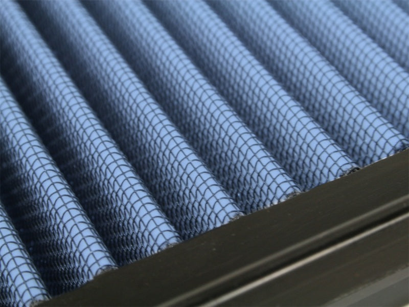 Close-up of aFe MagnumFLOW Air Filter showcasing its pleated design, optimized for Ford Trucks 99-03 V8-5.4L engines.